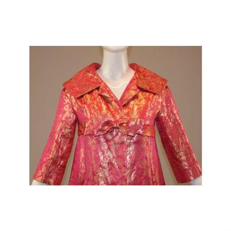 DESIGNER: 1960's Bob Bugnand Couture

Please contact for more information and/or photos.

CONDITION: EXCELLENT- JUST A FEW LIGHT VERY SMALL MARKS INSIDE THE JACKET AT THE HEM- WON'T BE SEEN BY OTHERS. THERE IS ONE TINY AREA OF GOLD ON THE BACK