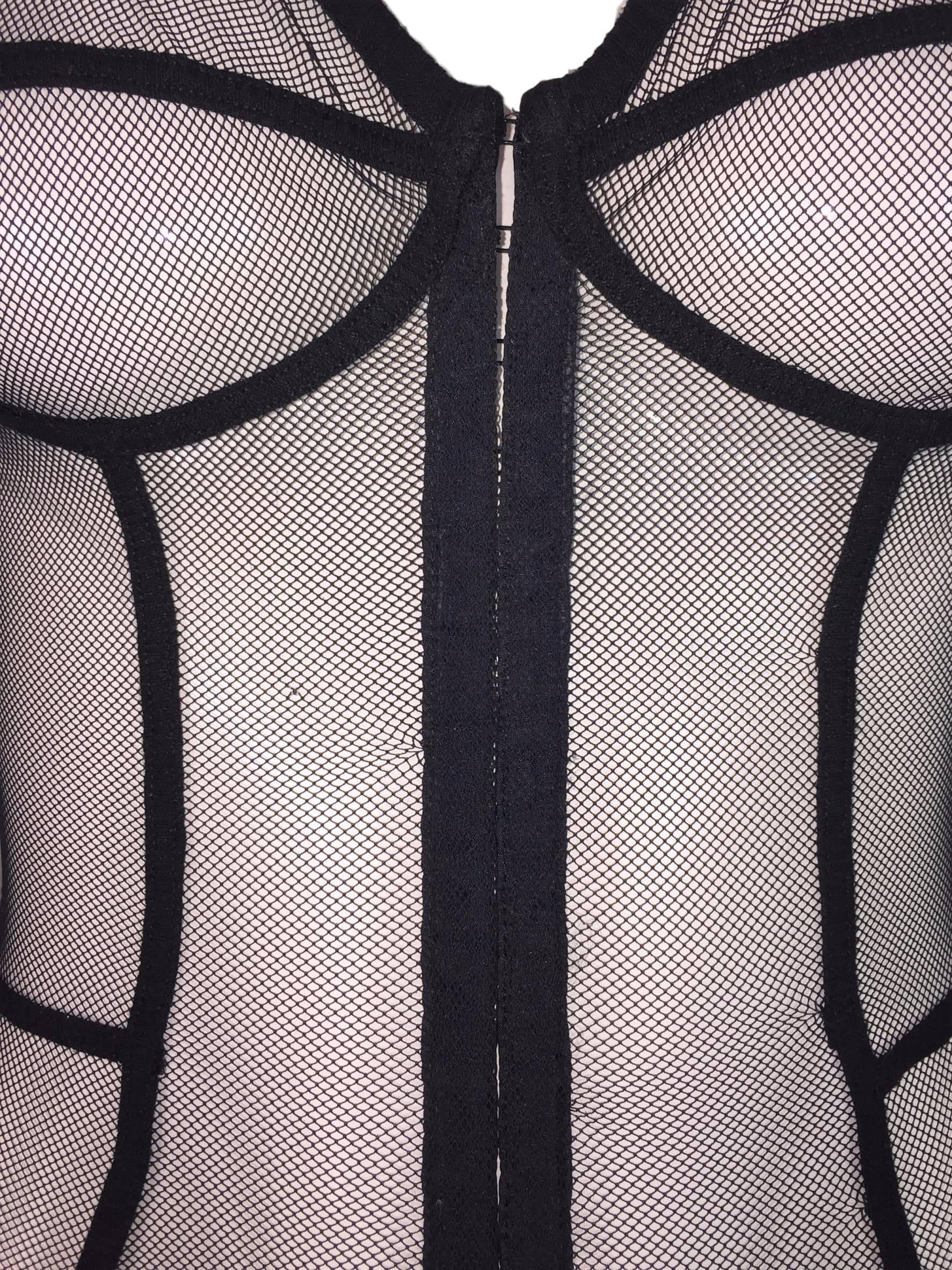 DESIGNER: 1990's Dolce & Gabbana Intimo

Please contact for more information and/or photos.

CONDITION: Good- has a few tiny repairs to mesh.

MATERIAL: Nylon/Elastane blend

COUNTRY MADE: Italy

SIZE: None- similar to XS/S with a lot of