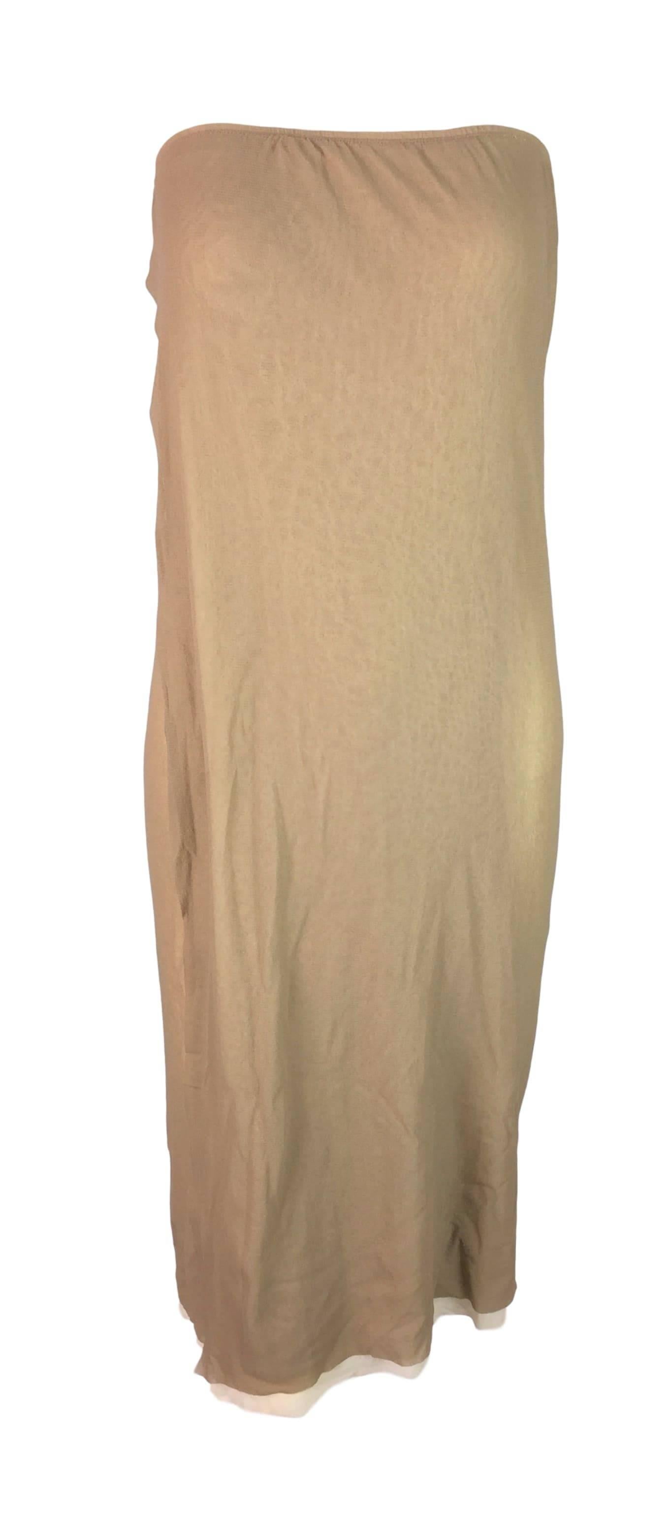 DESIGNER: 1990's Jean Paul Gaultier Classique- can be worn as a dress or skirt. 

Please contact for more information and/or photos.

CONDITION: New with tags

MATERIAL: Nylon blend

COUNTRY MADE: Italy

SIZE: Tag states medium but can fit an XS to