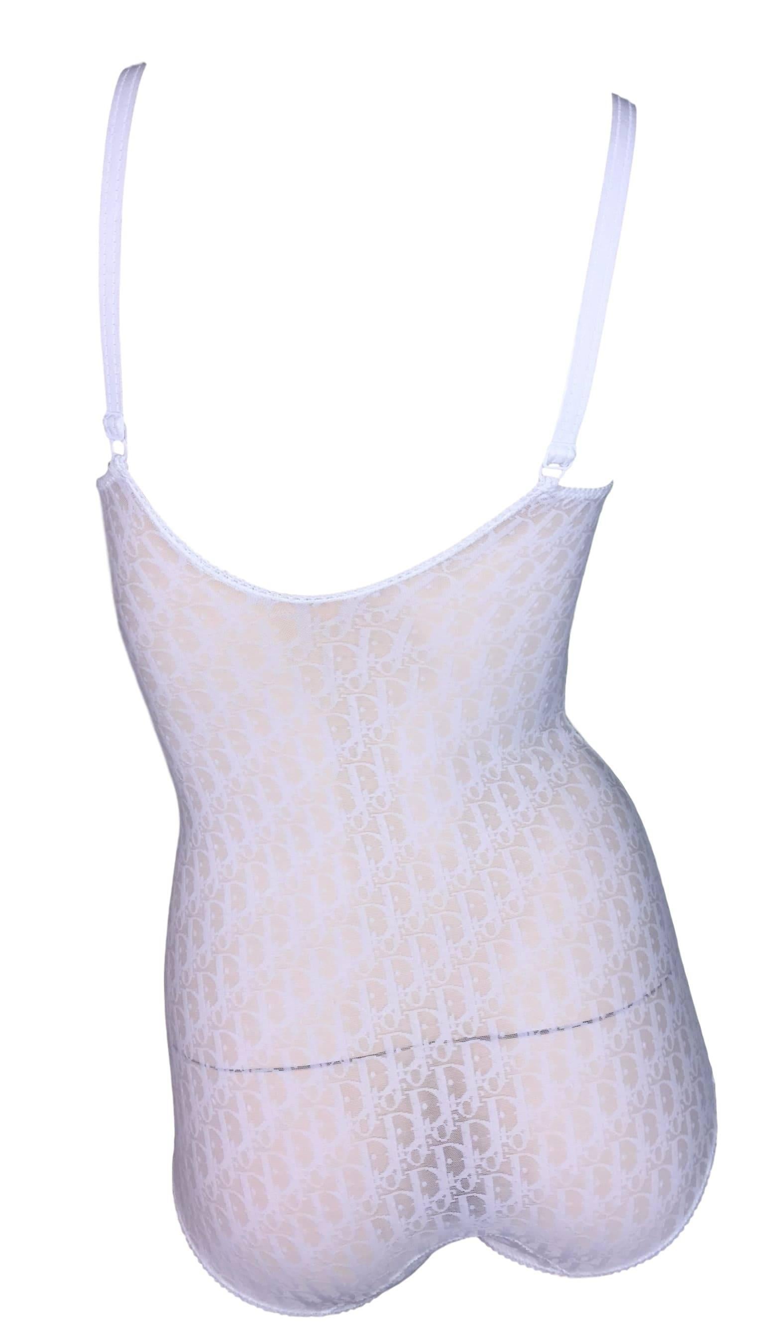 DESIGNER: 1990's Christian Dior

Please contact for more information and/or photos.

CONDITION: Excellent- the inner chest piece between the cups is slightly darker. Very minor and its inside. Please see photo. 

MATERIAL: Nylon/Spandex

COUNTRY
