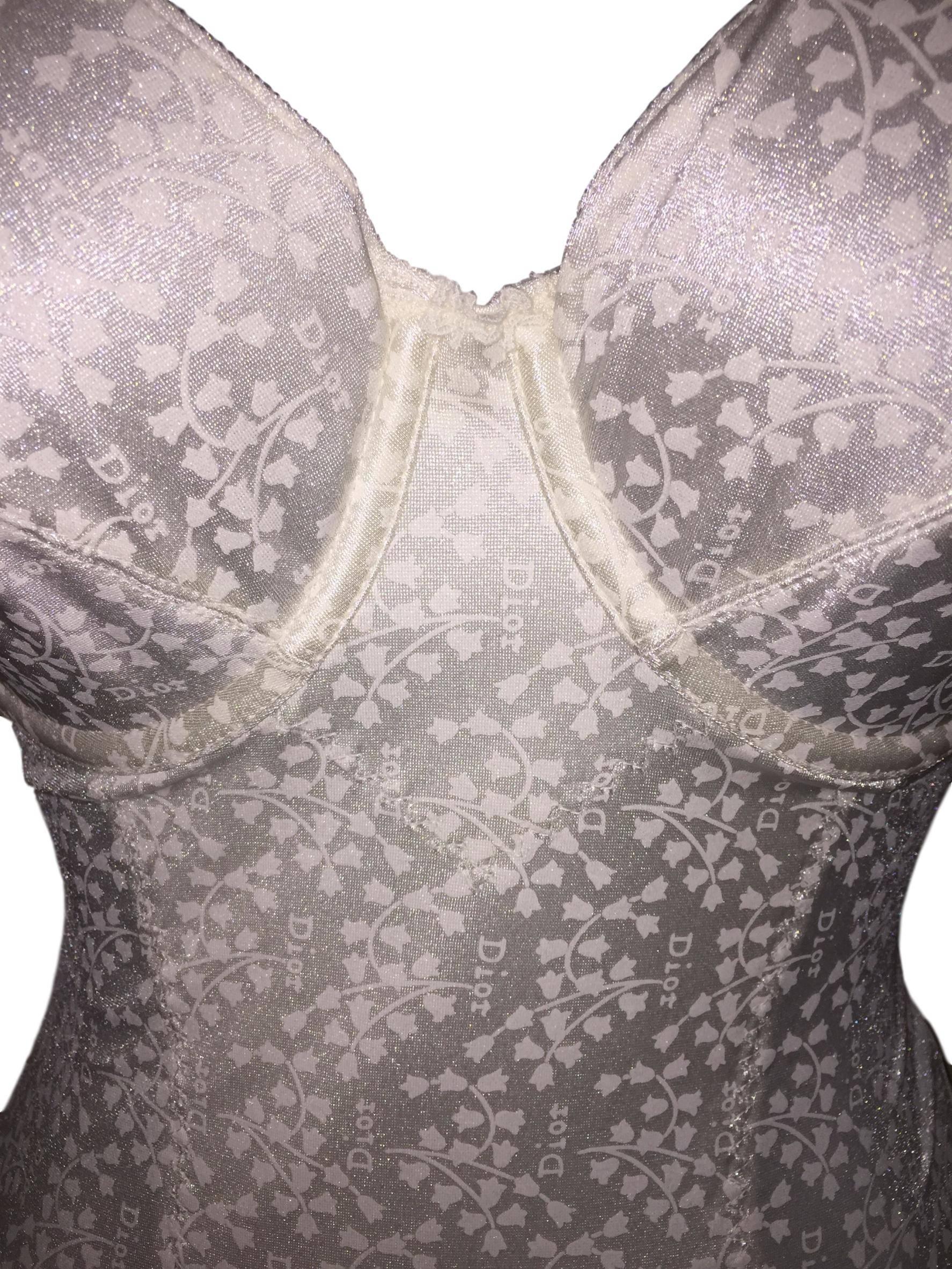 DESIGNER: 1990's Christian Dior

Please contact for more information and/or photos.

CONDITION: New with tags

MATERIAL: Nylon & Spandex

COUNTRY MADE: USA

SIZE: 36D- runs small with D cups, please review measurements

MEASUREMENTS; provided as a