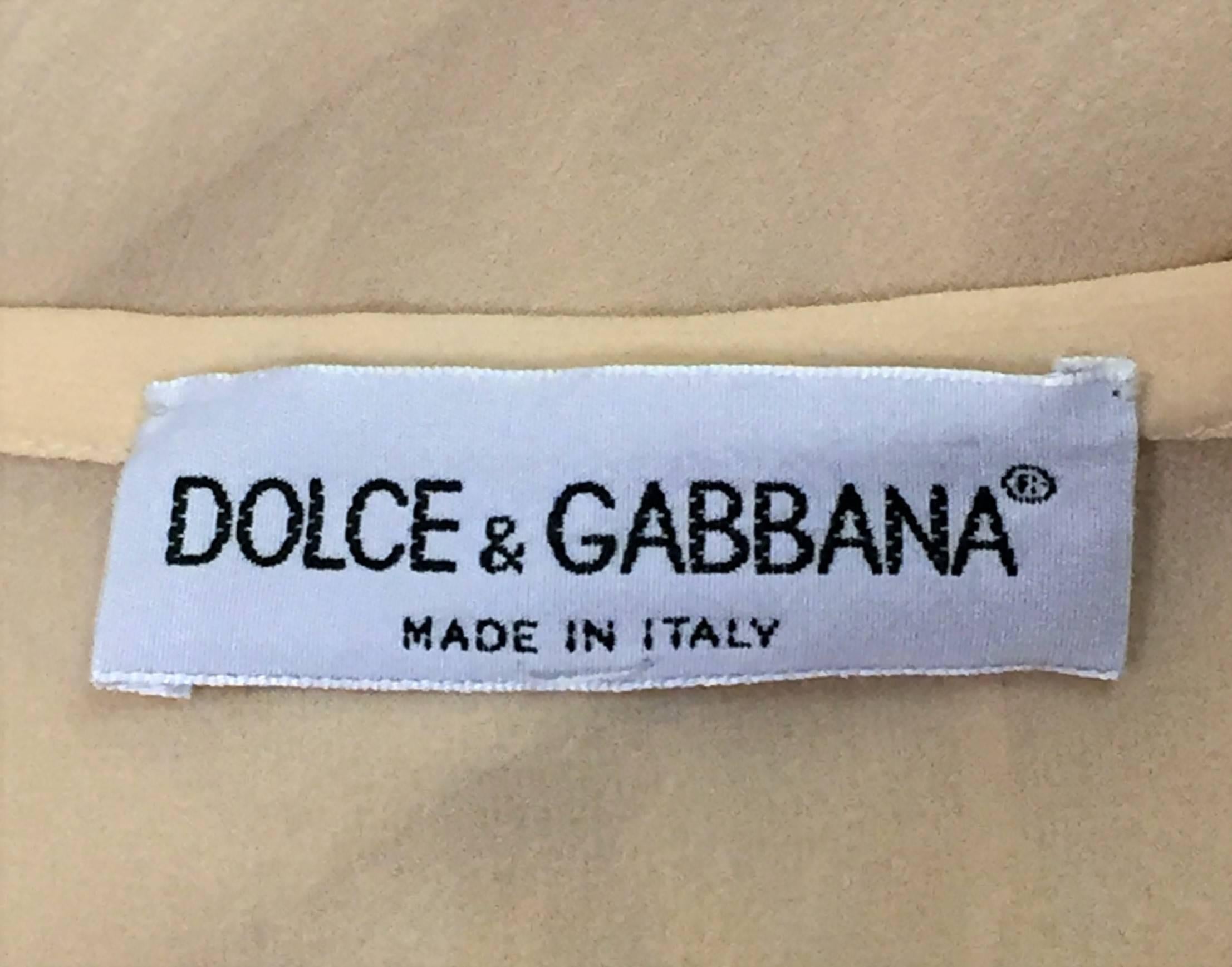 DESIGNER: S/S 1997 Dolce & Gabbana

Please contact for more information and/or photos.

CONDITION: Excellent

MATERIAL: 100% silk

COUNTRY MADE: Italy

SIZE: 40- runs small

MEASUREMENTS; provided as a courtesy only- not a guarantee of fit: 

Waist: