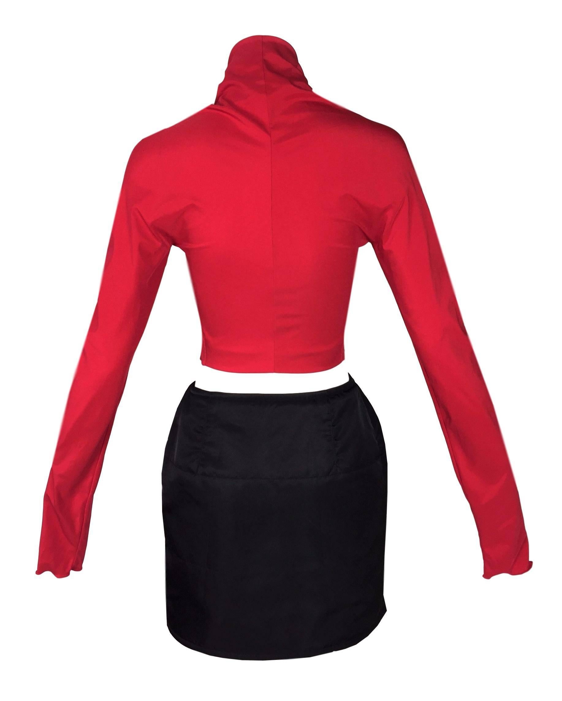 DESIGNER: 1992 Dolce & Gabbana

Please contact for more information and/or photos.

CONDITION: Excellent 

MATERIAL: Top- no fabric tag but has good stretch; Skirt- nylon, no stretch, with puffy down inside. 

COUNTRY MADE: Italy

SIZE: Top size 44
