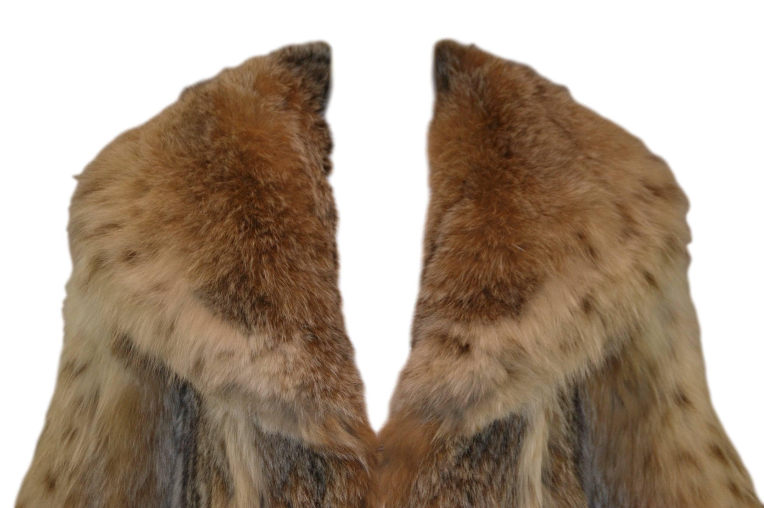 DESIGNER: 1980's Galanos

Please contact for more information and/or photos.

CONDITION: Good- fur is excellent- minor imperfections on lining.  Please see provided photos. 

MATERIAL: LYNX- CLIENT SAYS IT IS RUSSIAN LYNX BUT WE ARE NOT 100% SURE IF