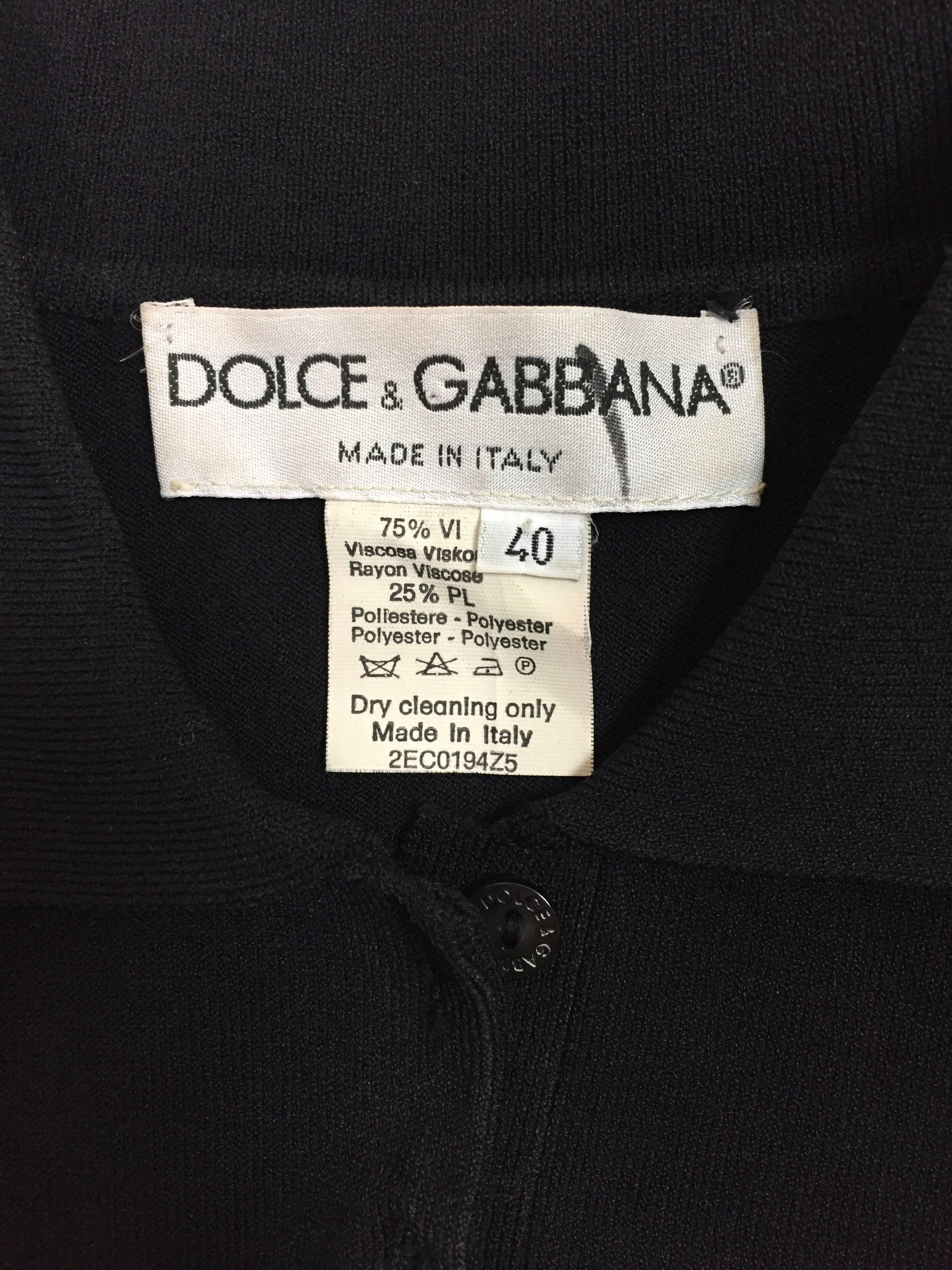DESIGNER: 1996 Dolce & Gabbana

Please contact for more information and/or photos.

CONDITION: Excellent

MATERIAL: Top is a stretchy viscose & polyester knit- Leggings are acetate/nylon/elastane

COUNTRY MADE: Italy

SIZE: Top size 40-