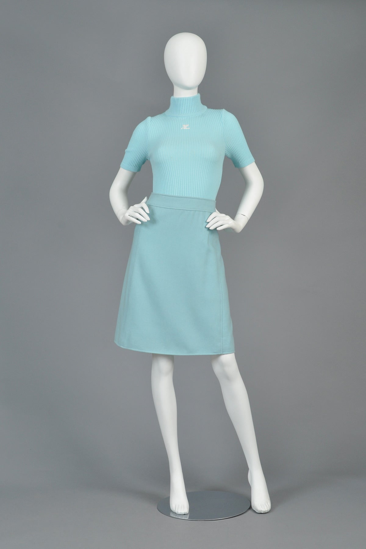 Classic vintage 1960s/70s Courrèges baby blue mod skirt. Simple, flattering shape with perfect stitched details. Concealed zipper on back quarter. Twilled wool blend. Fully labeled. Excellent vintage condition.

MEASUREMENTS
Waist: 25
