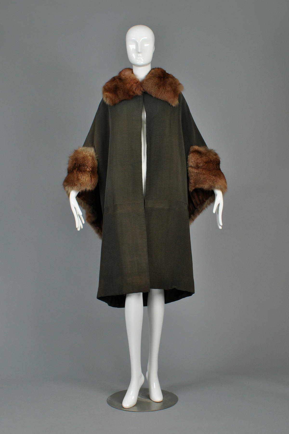 Just reduced $2200 to $1100

Beautiful dark cocoa colored coat, dating to the teens or very early twenties. Super rare find, especially considering this piece in very very pristine condition with only one tiny mark on the shoulder. It truly looks