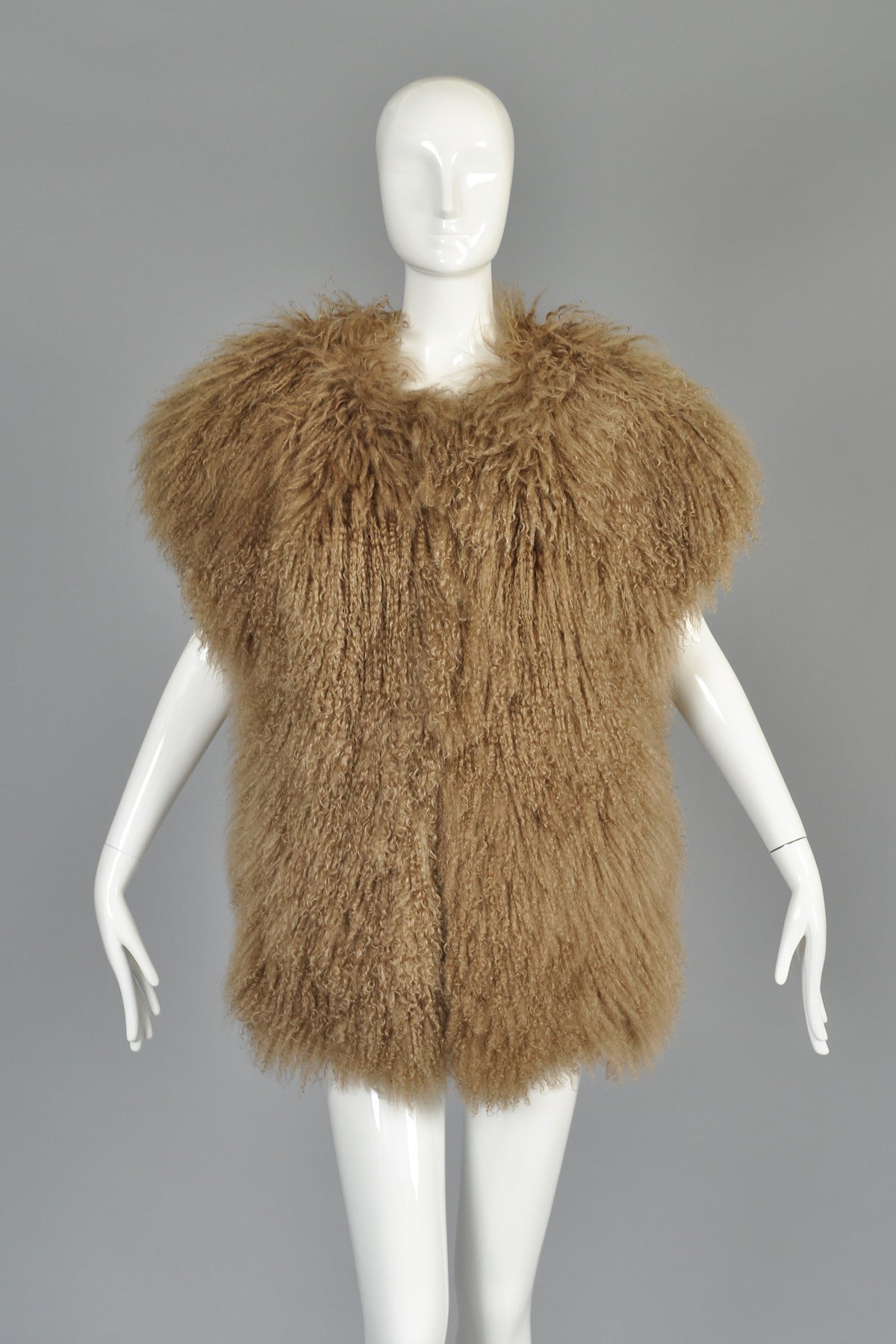 Ultra Shaggy 1980s Mocha Mongolian Lamb Fur Vest.  A super fucntional and classic find for any wardrobe! 

Super long and soft Tibetan lamb hair in a delicious mocha color. The photos have a slightly warmer tone than in real life.  Simple straight