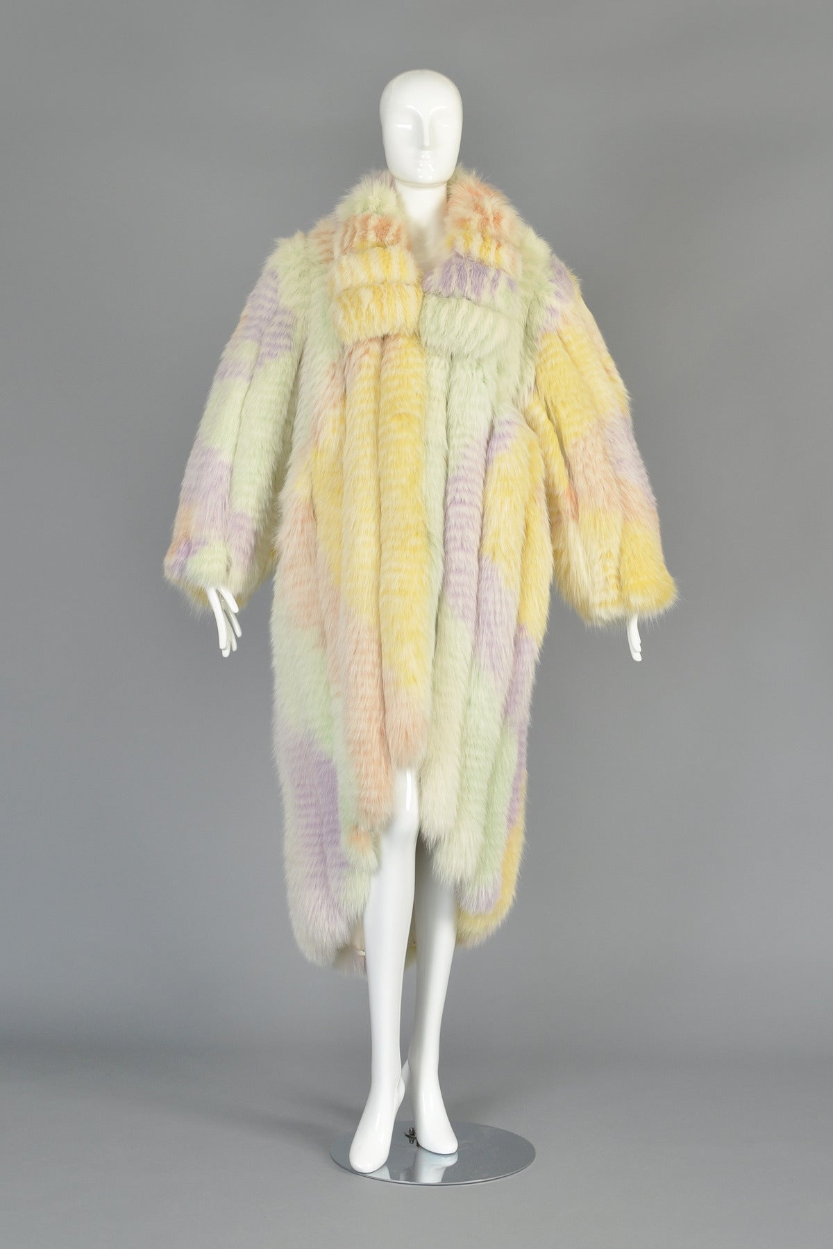 Just reduced from $4800 to $2500

Seriously amazing 1980s rainbow fox fur coat. INCREDIBLE, incredible, one-of-a-kind find. Ultra thick and plush dyed fox fur in a myriad of pastels. Oversized collar. Ultra wide, thick pelts are vertically laid