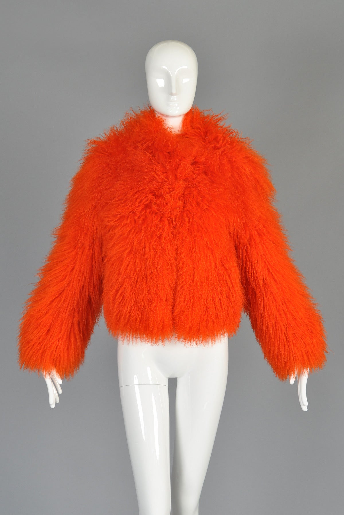 Seriously awesome bright bright bright orange Tibetan lamb fur coat by Sonia Rykiel. Such a rad piece! Ultra short waist-length crop with long sleeves and ultra ultra shaggy long hair. Fully lined with hidden fur hook closures and pockets. Pristine