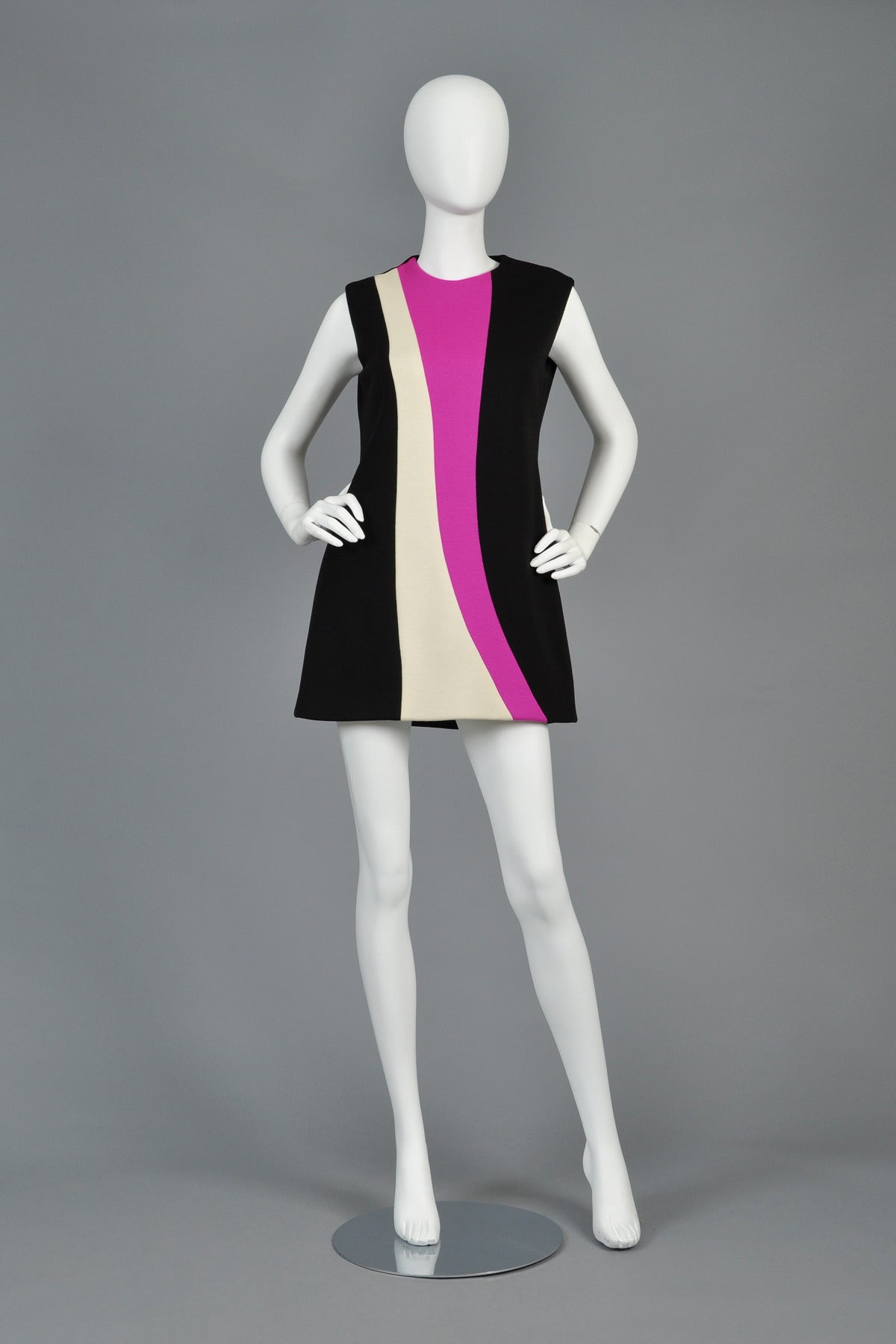 Fantastic 1960s Pierre Cardin color blocked couture  tunic. Classic Cardin space age beauty. High neck and sleeveless with slightly flared hem. Can easily be worn as a tunic over pants or a mini dress. Heavyweight wool crepe. Zips in back. Excellent