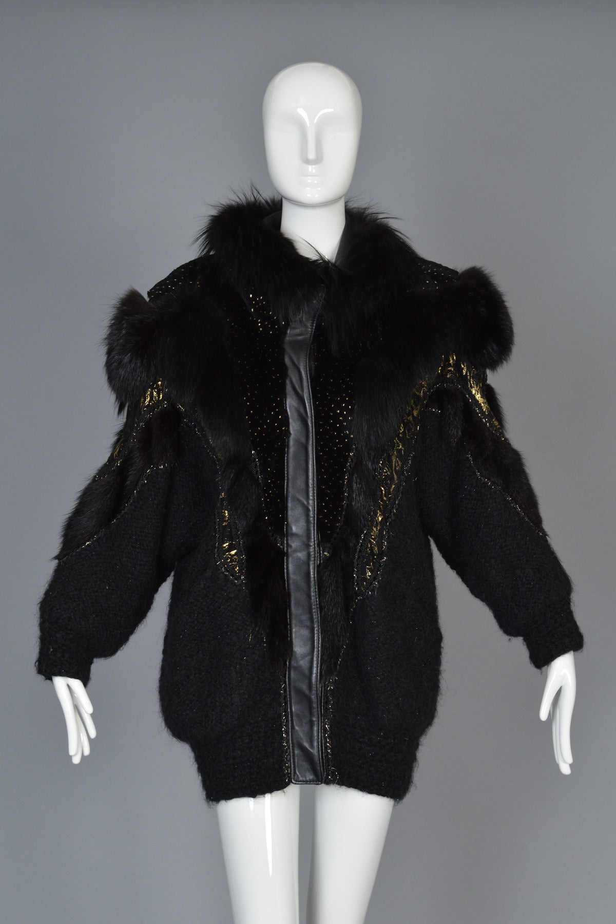 Recently reduced from $650 to $450

Seriously awesome vintage 1980s black heavy-weight mohair + acrylic knit coat. Incredible, avant garde find! Cocoon cut with besom pockets and raglan sleeves. Snapping front with black leather plackets. AMAZING