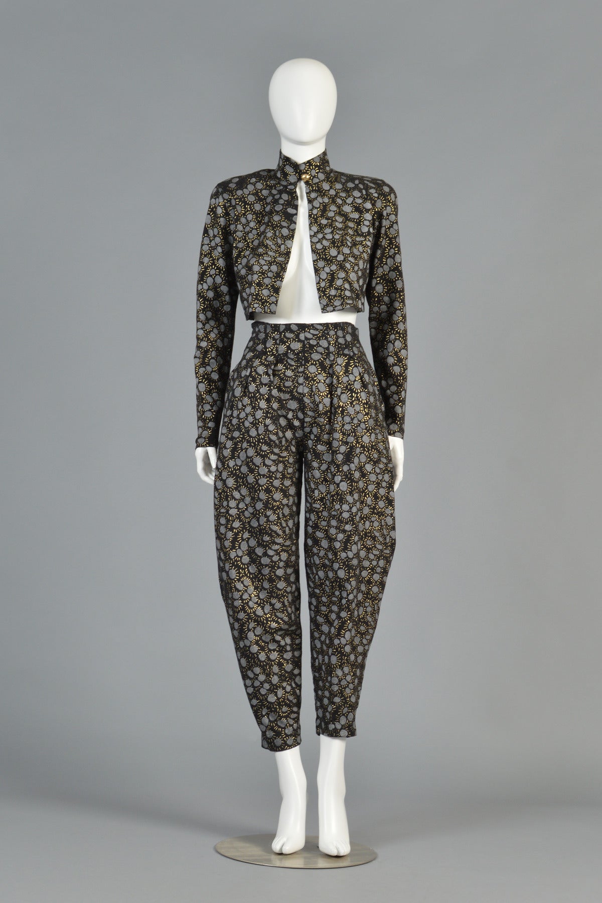 KILLER 1980s vintage Betsey Johnson 2-piece jacket and pant ensemble. Ultra hard to find + collectible Punk Label. The set consists of cropped long sleeve jacket with single gold button closure and high elastic-waist draped pants with besom pockets