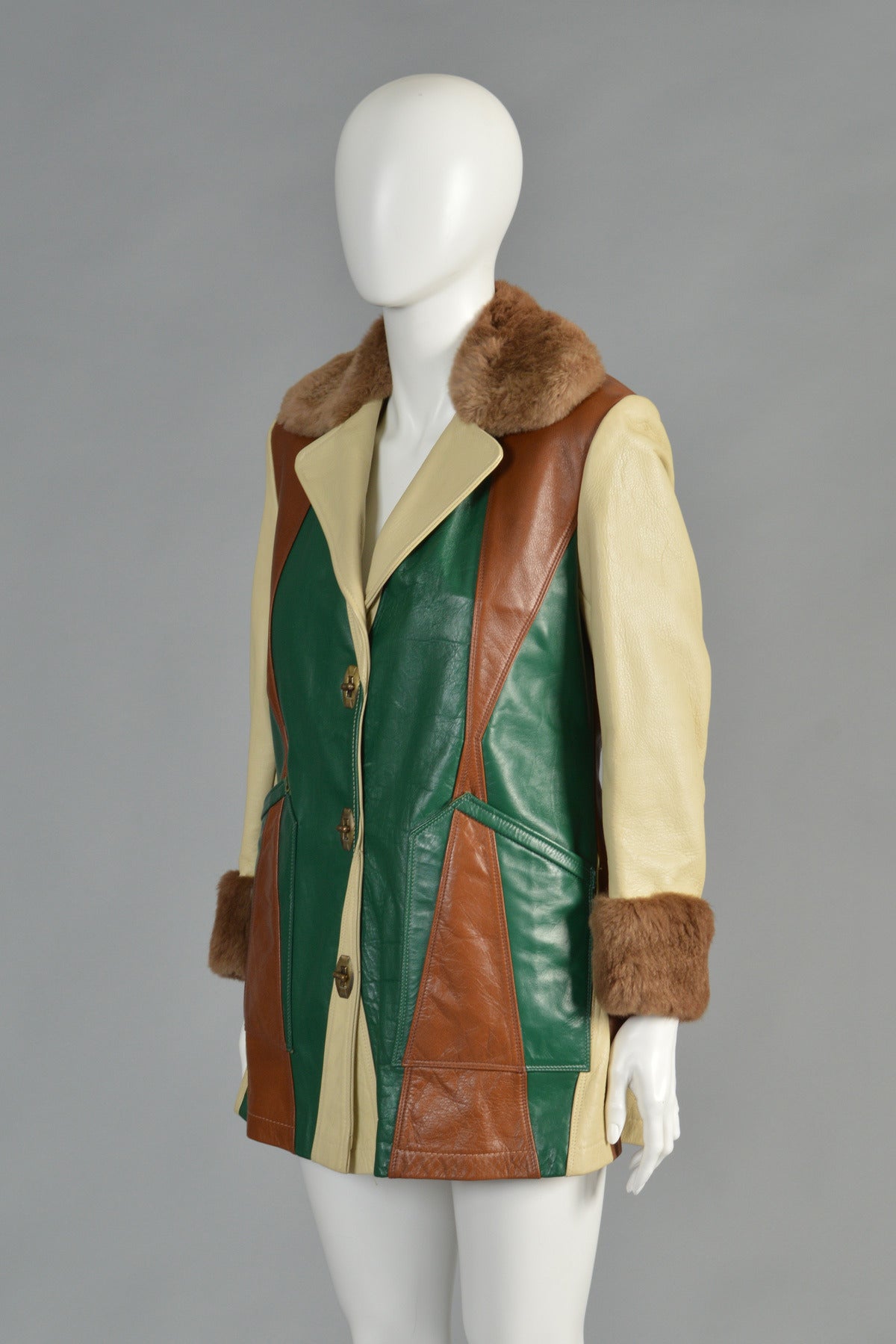 Absolutely awesome 1970's patchwork leather jacket. AMAZING piece! One-of-a-kind custom made piece. Killer pie-piece patchwork leather in green, pale yellow and sienna. Sheared beaver collar and cuffs with genuine shearling lining. Super skinny cut