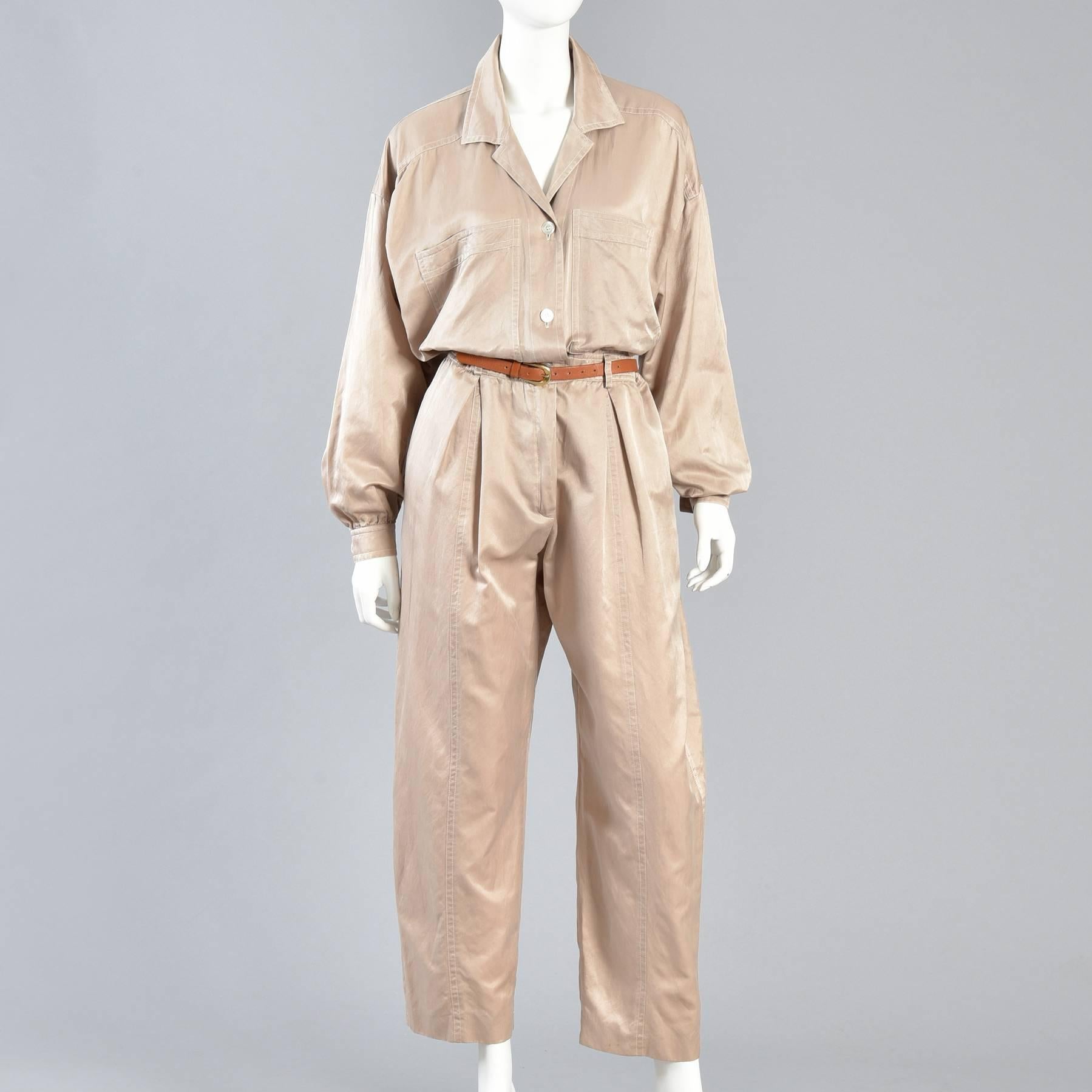 Minimalist Escada Menswear-Look Silk Jumpsuit

Killer vintage 1980s silk & cotton blend Escada slouchy fitting flight suit. Such a great find! 

Pale champagne colored silky soft body in the most comfortable slouchy fit imaginable. Button front
