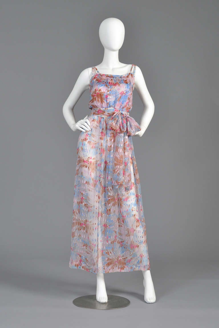 Lovely 1970s/early 80s Ted Lapidus silk maxi dress. Gorgeous watercolor floral pattern with sheer and opaque panels. Blousy boside with double strapes, nipped waist + flared skirt. Excellent vintage condition. Entirely sheer so you will need a slip.