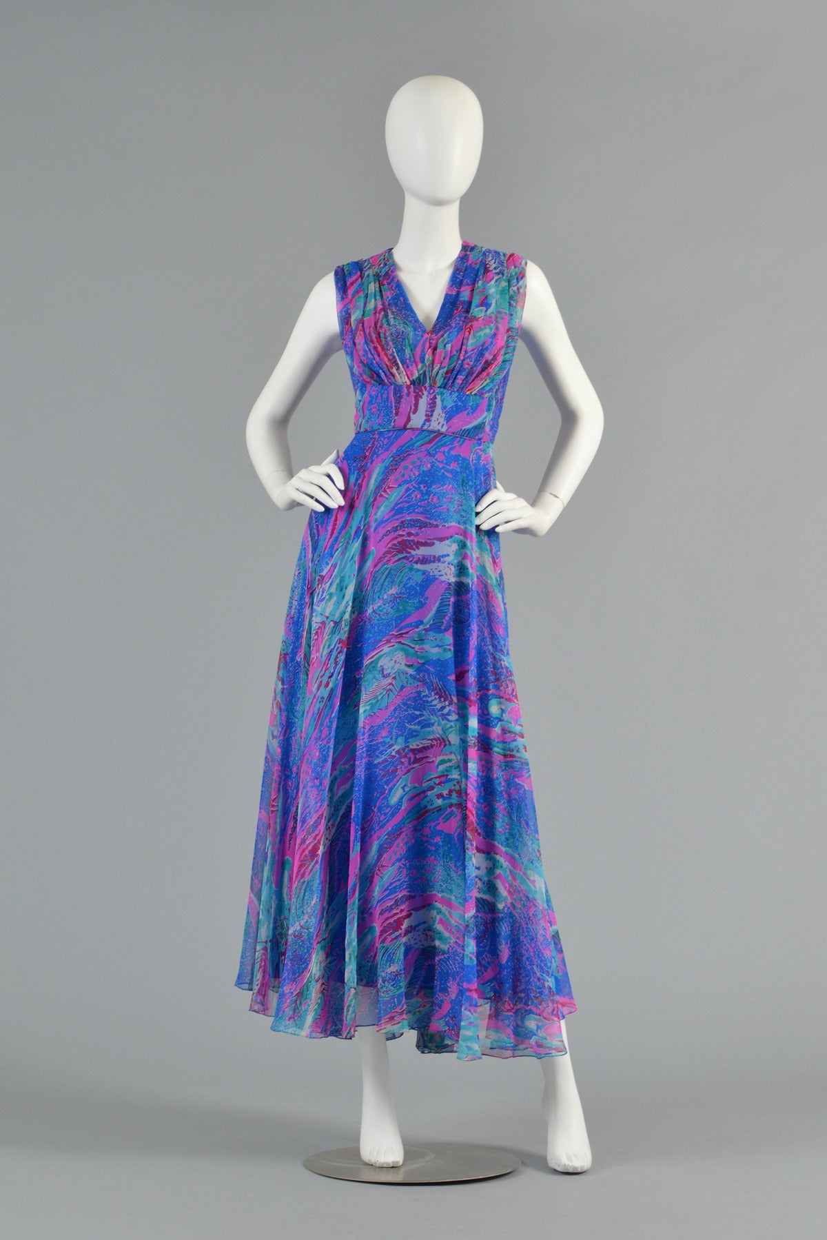 Absolutely awesome 1960's silk chiffon maxi dress. BEAUTIFUL piece and perfect for any spring or summer event! Painterly swirled pattern in shades of blue, lavender and aqua silk chiffon. Gathered bodice with plunging neckline and bias-cut flared