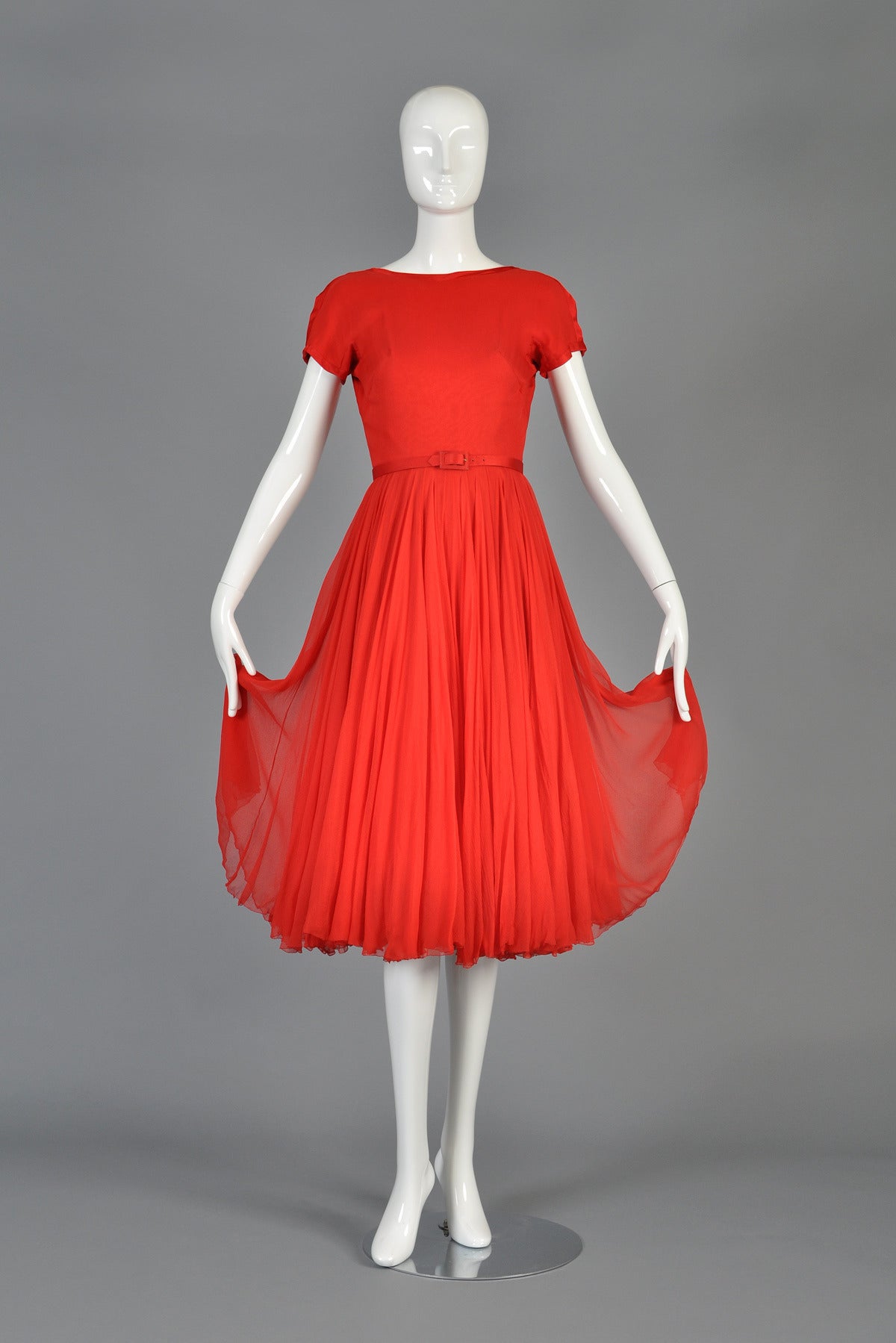 Beautiful circa 1951 party dress by the most superb of American designers, James Galanos. Known for his beautiful, near couture construction, this dress is sure to quench the thirst of even the most devoted collector.

Comprised of layers and