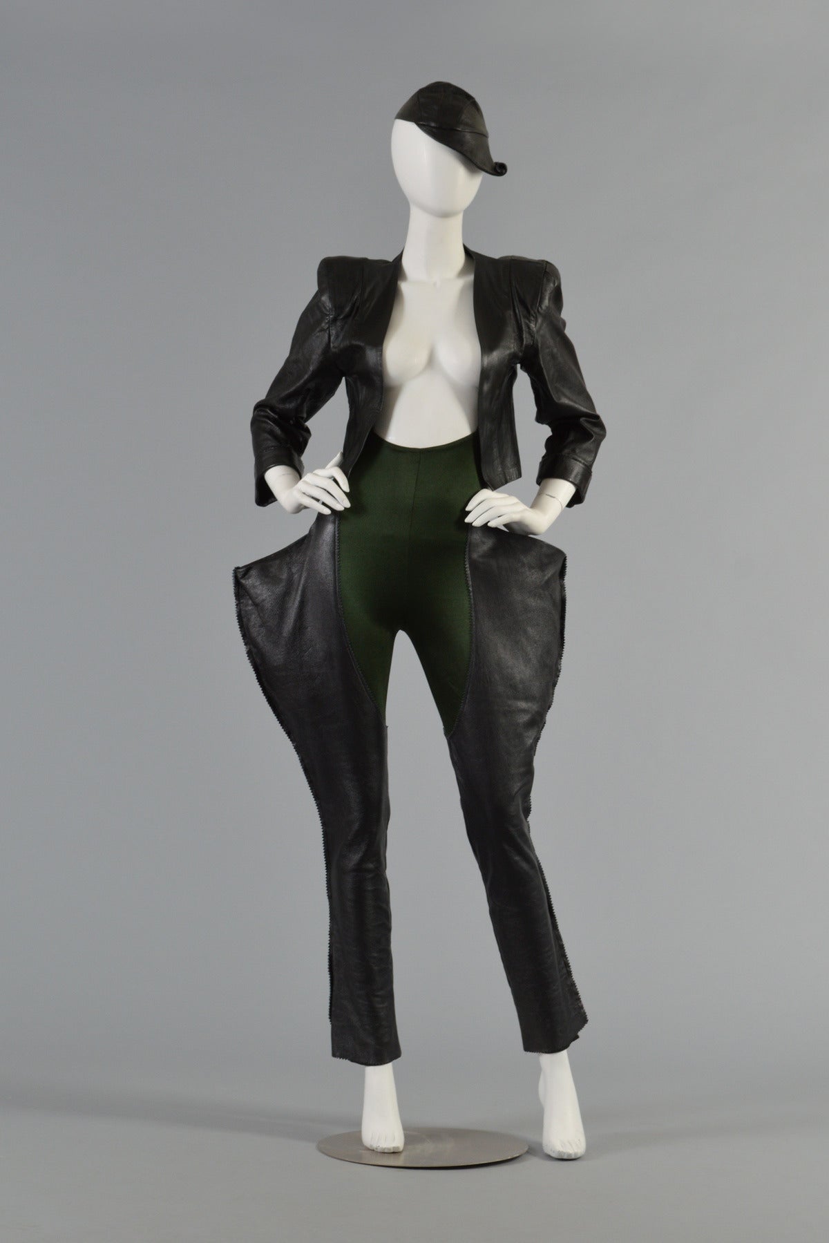 Iconic vintage 1979 Norma Kamali 3 piece leather + spandex ensemble. 
Extremely rare very early OMO label. We have seen photos of this set but have NEVER seen it for sale anywhere. 

Ultra snug evergreen colored disco-weight spandex suspender