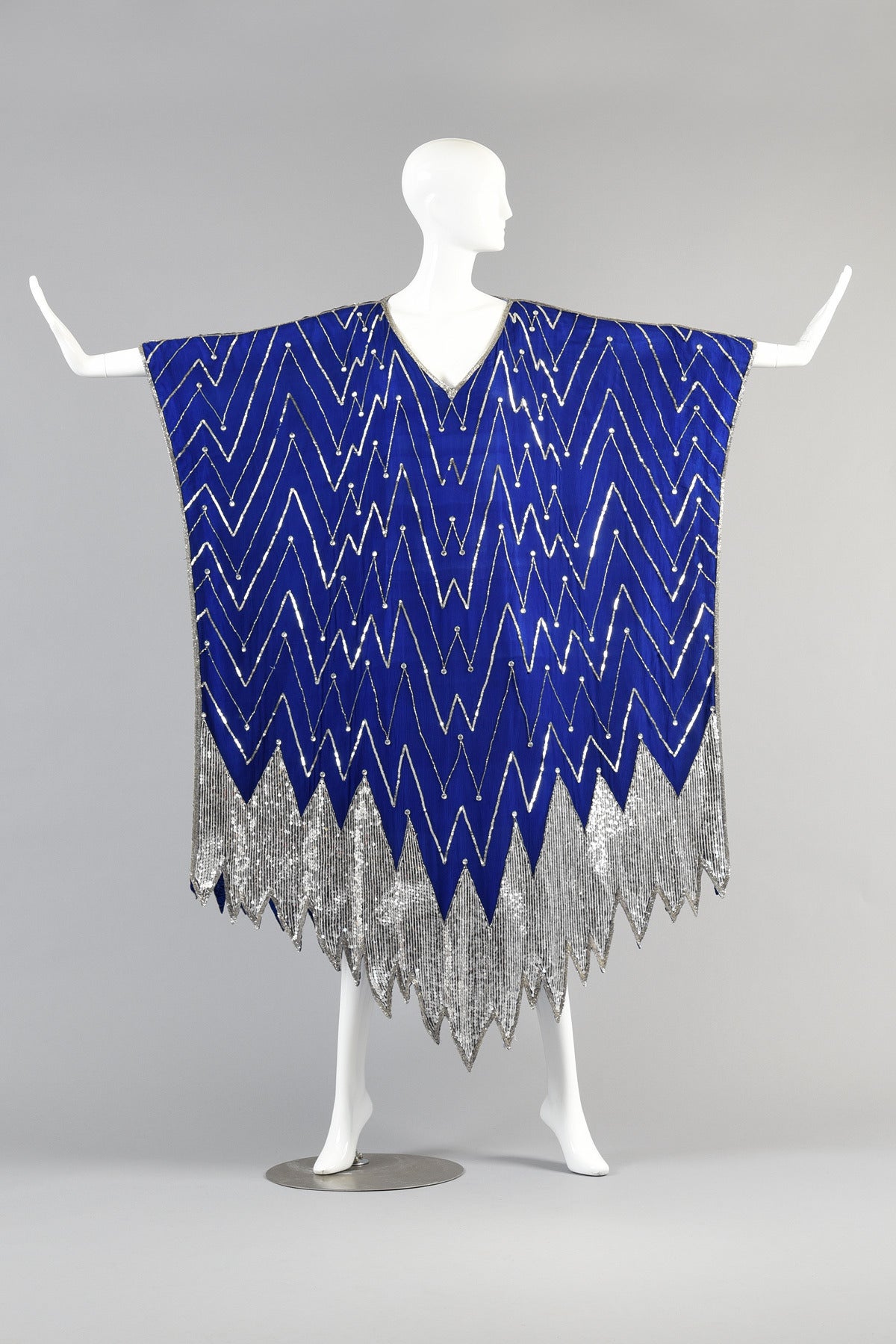 Seriously gorgeous art deco inspired vintage 1980s lapis colored silk maxi caftan. SUCH an incredible find! Plunging v-neck metallic silver sequin zigzags + asymmetric sequined hem. Semi-sheer but is lined so you may not need a slip beneath. Heavy