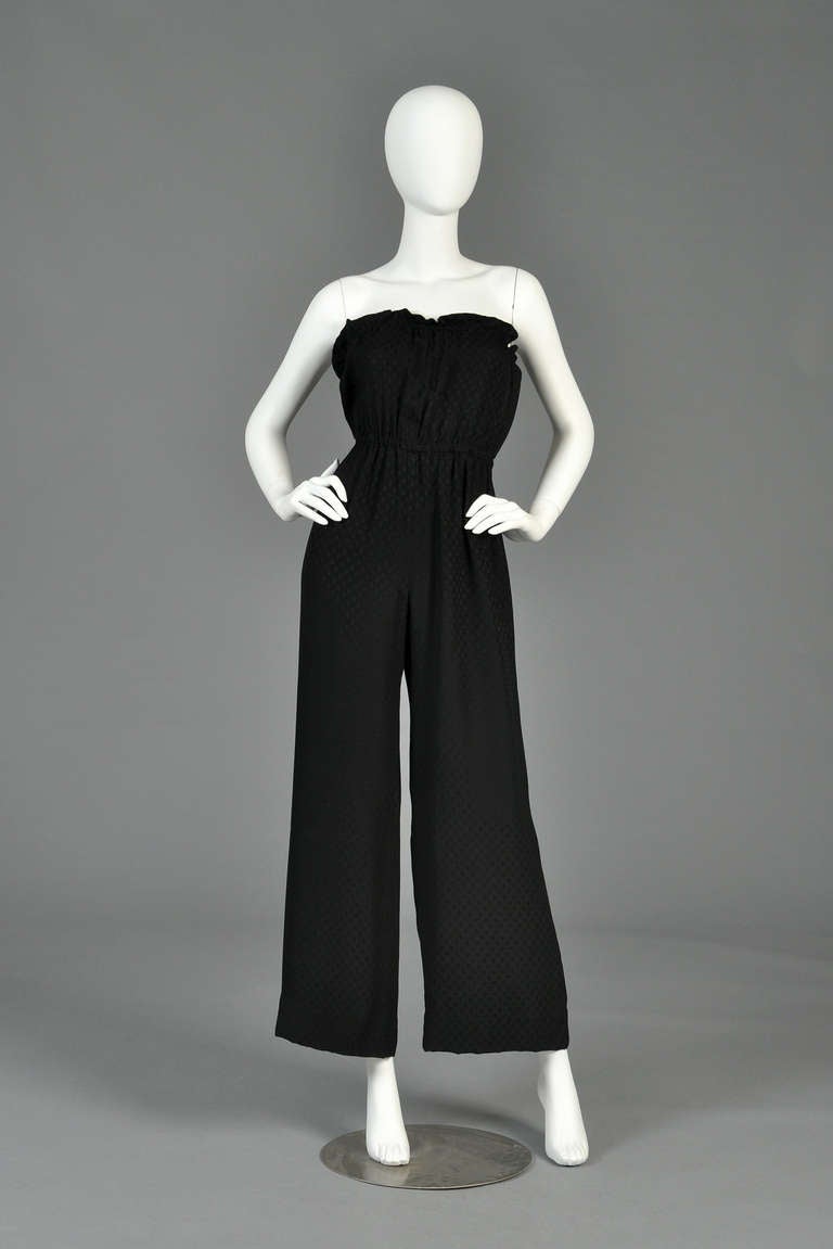 Ultra lovely + super simple late 70s/early 80s Givenchy silk jumpsuit. Tone on tone black silk with swirled circle woven pattern. Classic strapless bodice with elasticized waist + bustline and simple flared legs. So versatile - Pair this with a