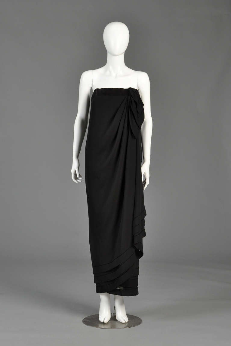 Truly stunning very late 1970s/very early 80s Guy Laroche strapless haute couture evening gown. Three layers of black sheer silk chiffon draped on the bias and tied at the bust. We love the contrasting opaque edges of the silk. Exquisite haute