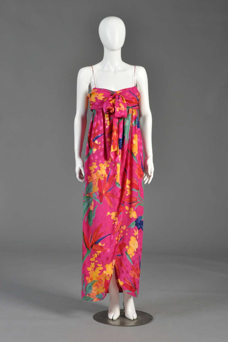 Just reduced from $695 to $395

Beautiful vintage 1980s Miss O by Oscar de la Renta silk gown with matching shawl. Ankle-length magenta silk gown with tropical floral print. Ruched bodice with giant bow + thin straps (could be worn strapless if