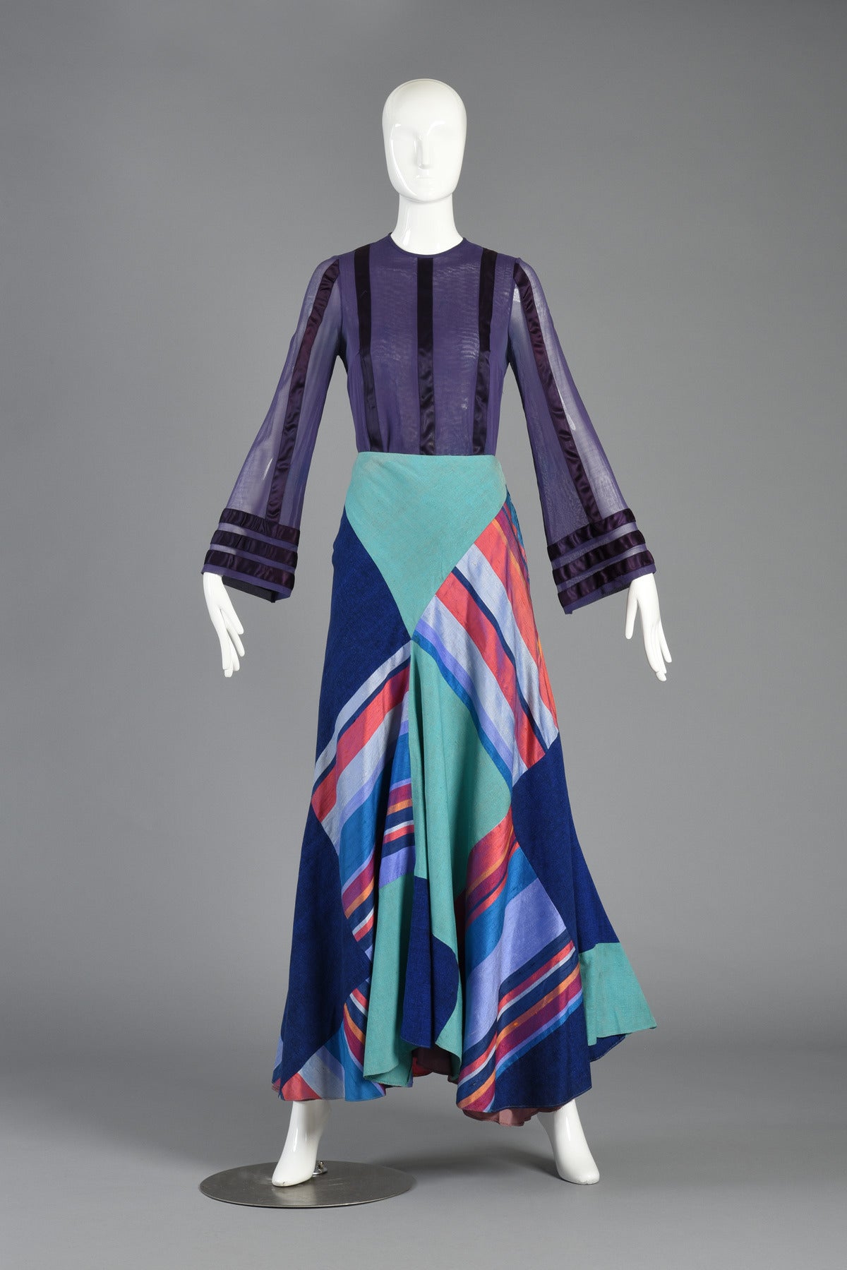 Absolutely awesome 1970's Thea Porter Couture patchwork silk maxi skirt. INCREIDBLE piece with asymmetric hemline and high waist. The richest, most decadent colors comprise this bias cut piece. We love how one side hangs lower and has a definitely