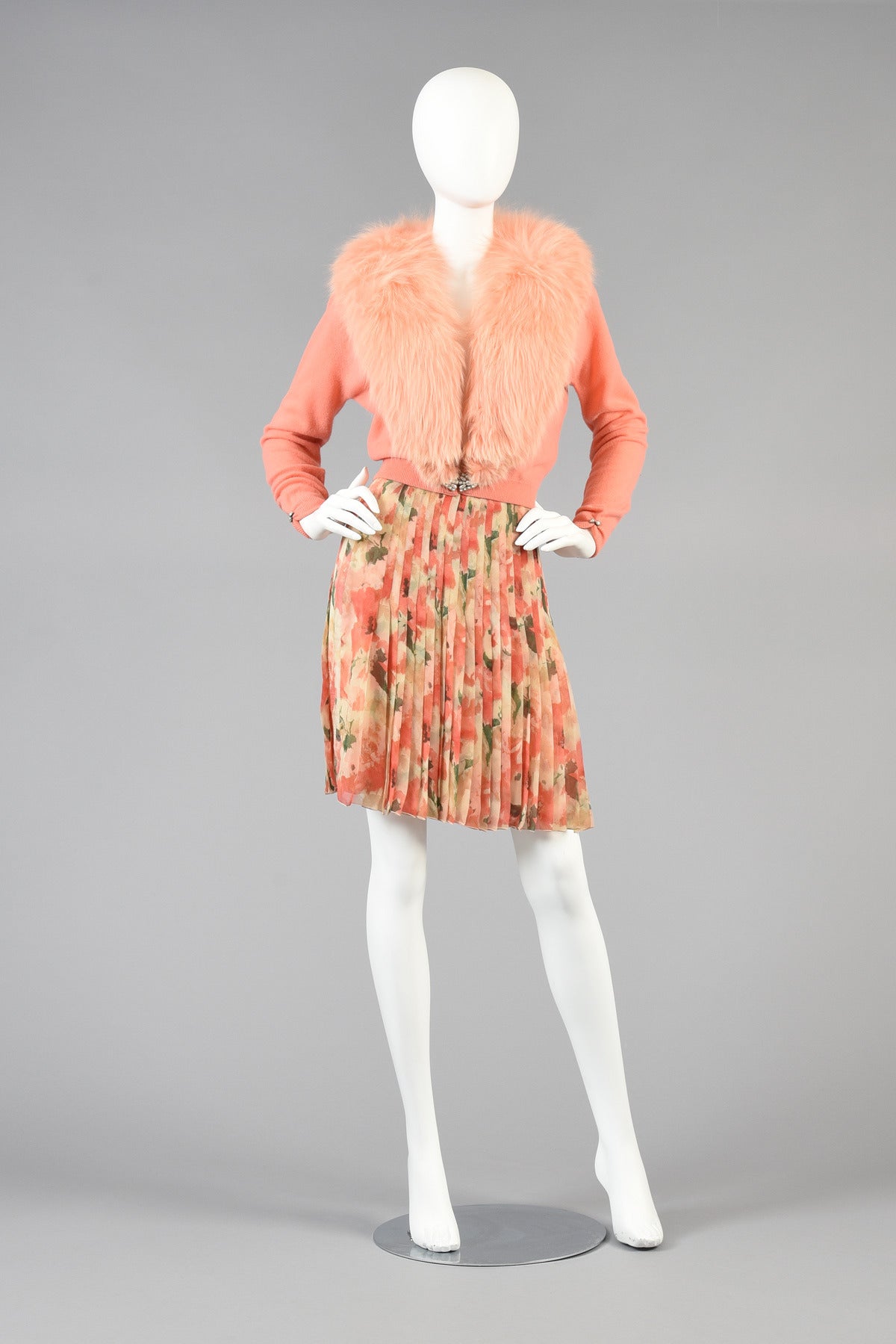 Lovely 1950's salmon colored cashmere and fox fur cardigan by Dalton. Ultra classic and covetable find! Lovely ultra soft 100% cashmere body with pearl clasp at the waist and gathered cuffs. MASSIVE removable fox fur collar. Beautiful lace and mesh