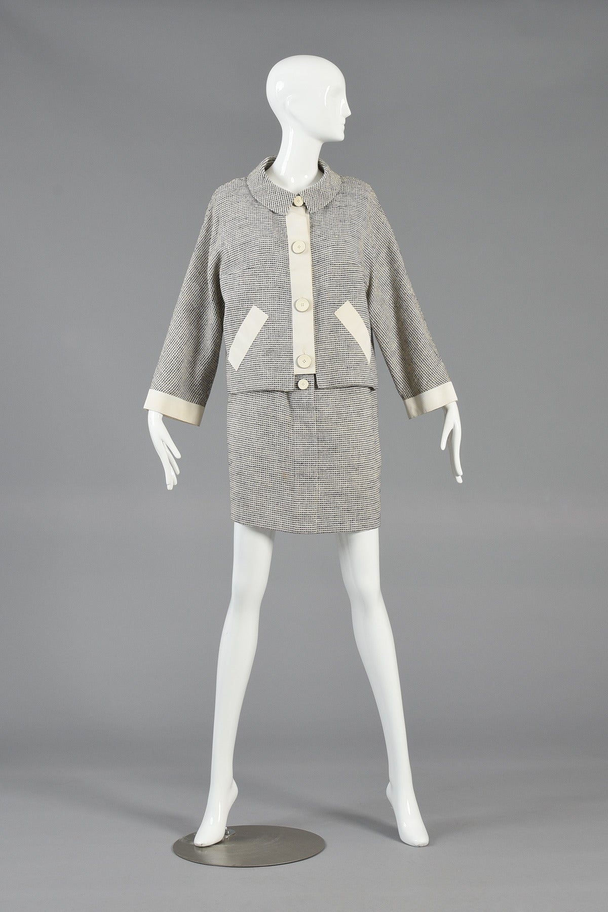Super cute 1990s 2-piece dress and jacket set by Karl Lagerfeld. Such a great find!

Adorable button front sack dress with metal trimmed ivory buttons. 

The jacket features kimono-esque sleeves with grosgrain details and matching metal trimmed