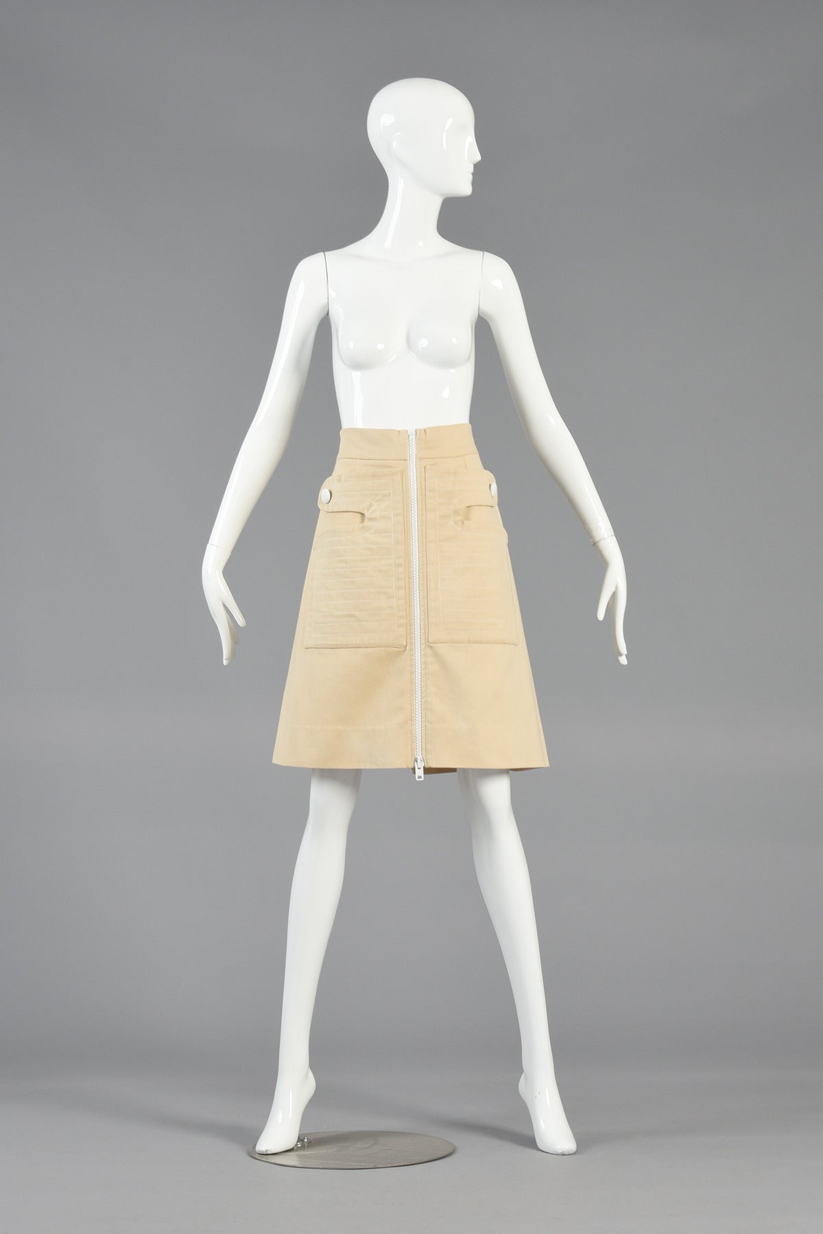Killer 1960's buttercream colored Pierre Cardin space age skirt. Absolutely awesome find! Buttercream heavy-weight brushed cotton (almost feels like a brushed denim) with wide adjustable zipper down the front. Of course the best part though are the