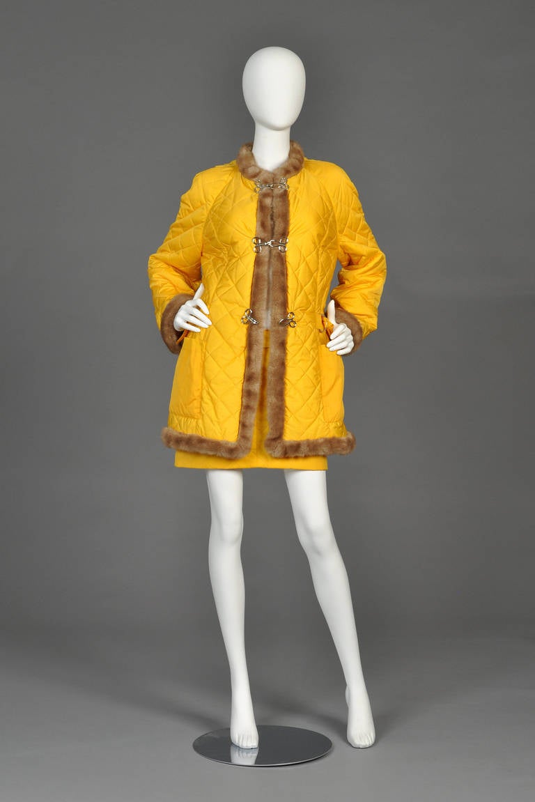 Superbly bright vintage 1980s suit ensemble by Jean Charles de Castelbajac. Matching yellow quilted coat + skirt. Coat is entirely trimmed with blonde faux fur. Silver metal hook closures. Awesome set!

MEASUREMENTS
Coat
Bust: 41