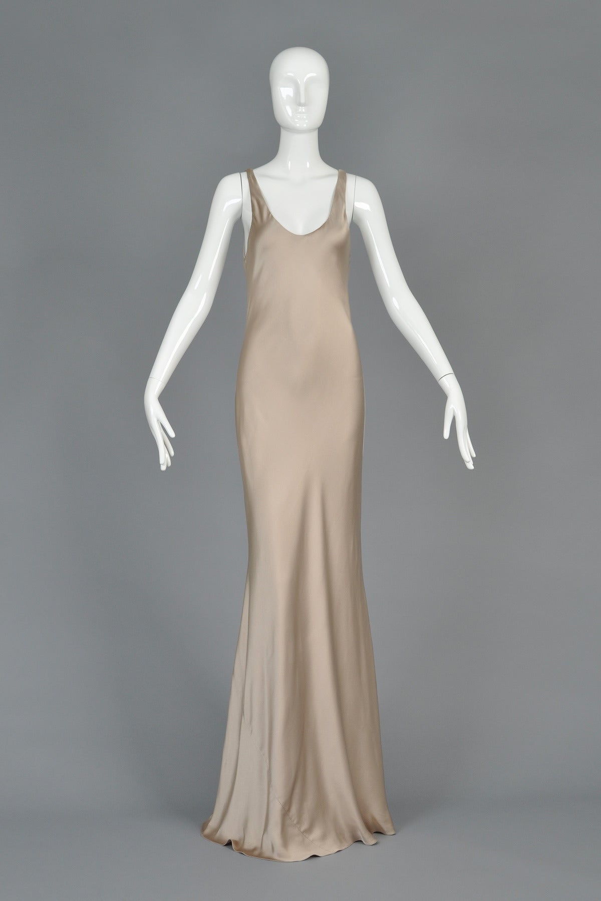Truly stunning ca 2012 Ralph Lauren Collection Purple Label silk charmeuse evening gown in pale golden beige. Simple and chic to the extreme! Scoop neck in front and back with bias-cut slip body and flared skirt. Supermodel length — our 5’9” model