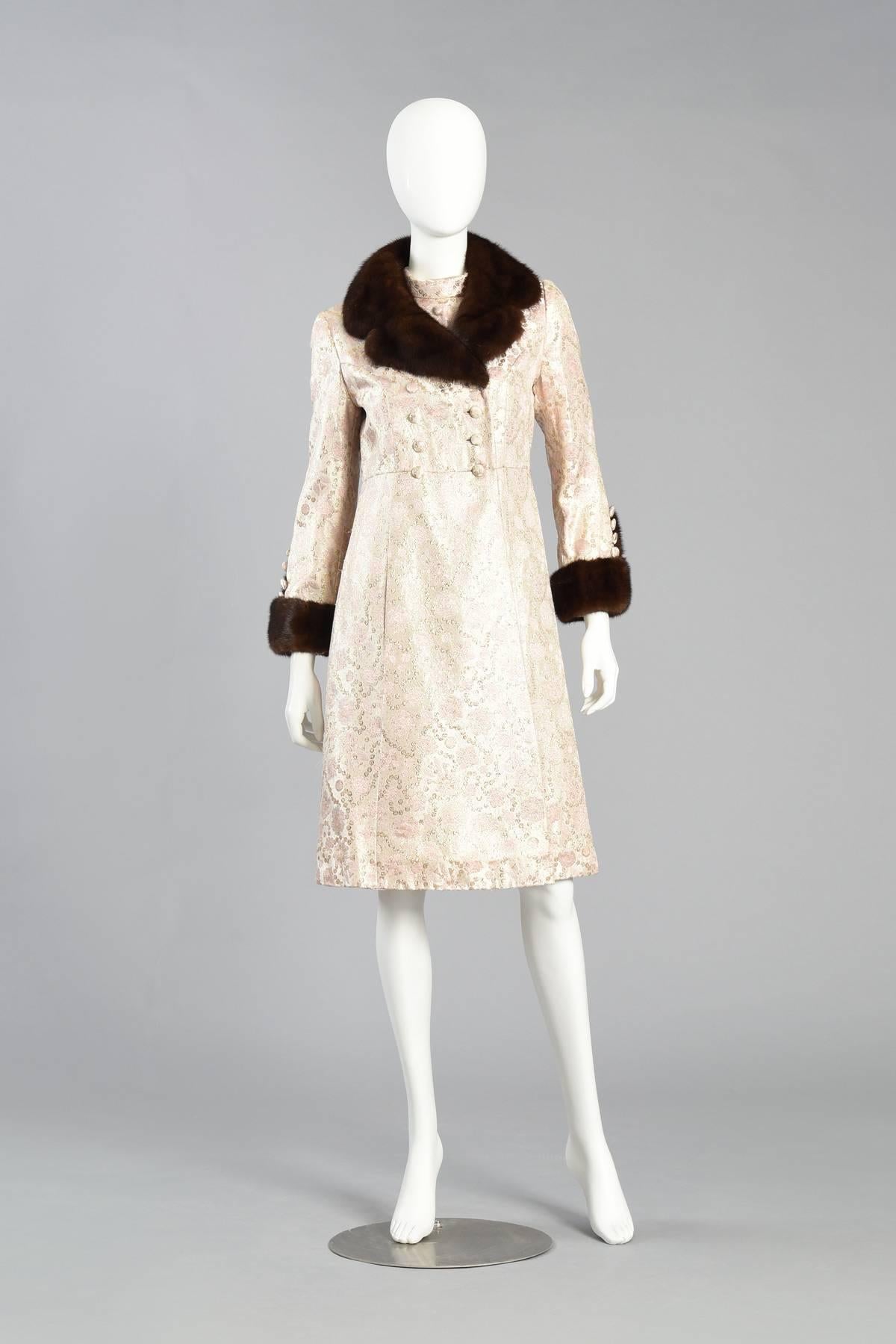 Darling 1960s pale pink brocade dress and jacket ensemble. Such an incredible color palette! The dress features a fitted bodice with mock neck, covered buttons and pleated, flared, a-line skirt. The matching coat features a double breasted, fitted