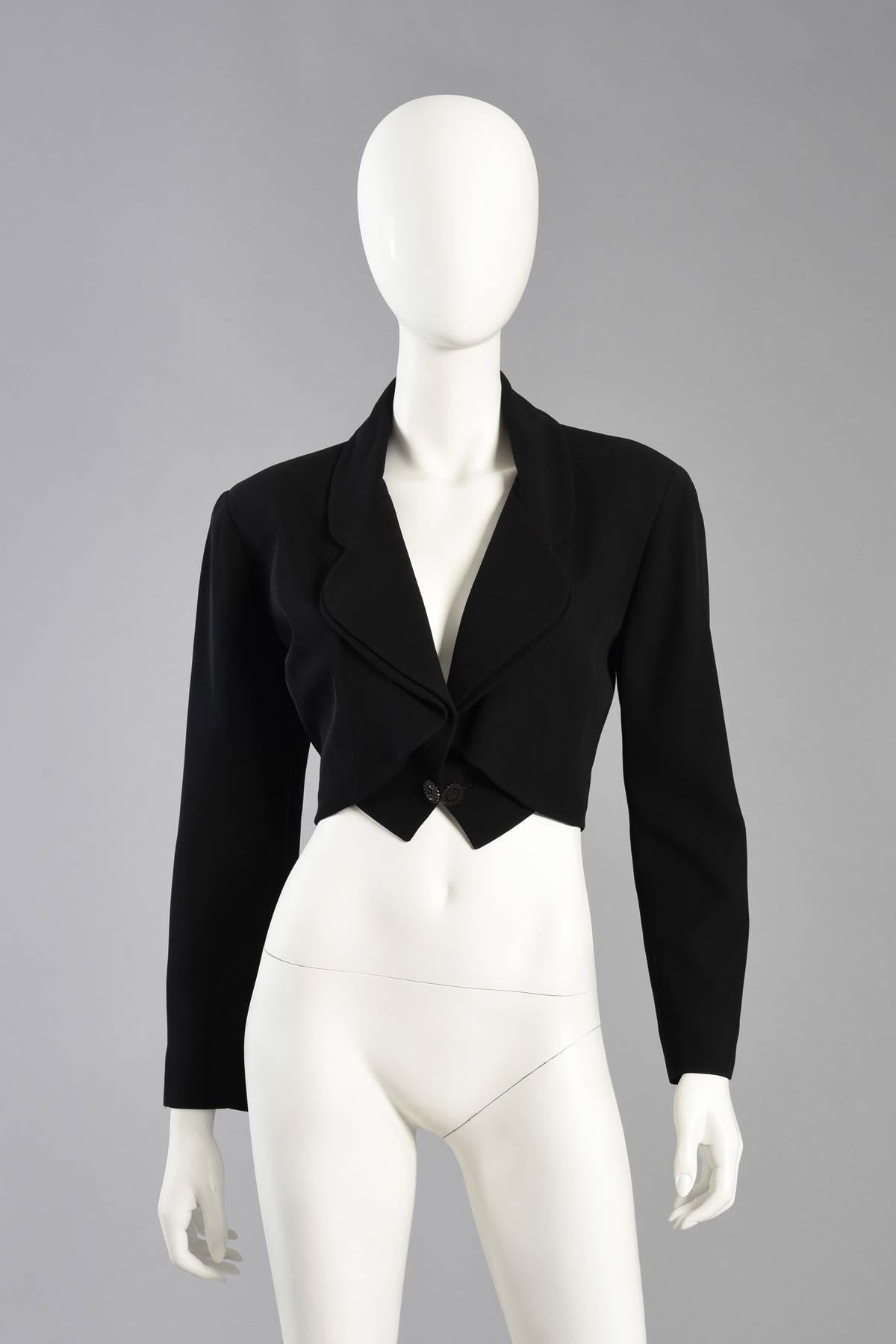 Super cute 1990s Karl Lagerfeld cropped tux jacket. Made from silky rayon, the jacket features slightly oversized shoulders, double lapel and single button closures. Fully lined and labeled. 

Please note - this listing is for the jacket ONLY. The