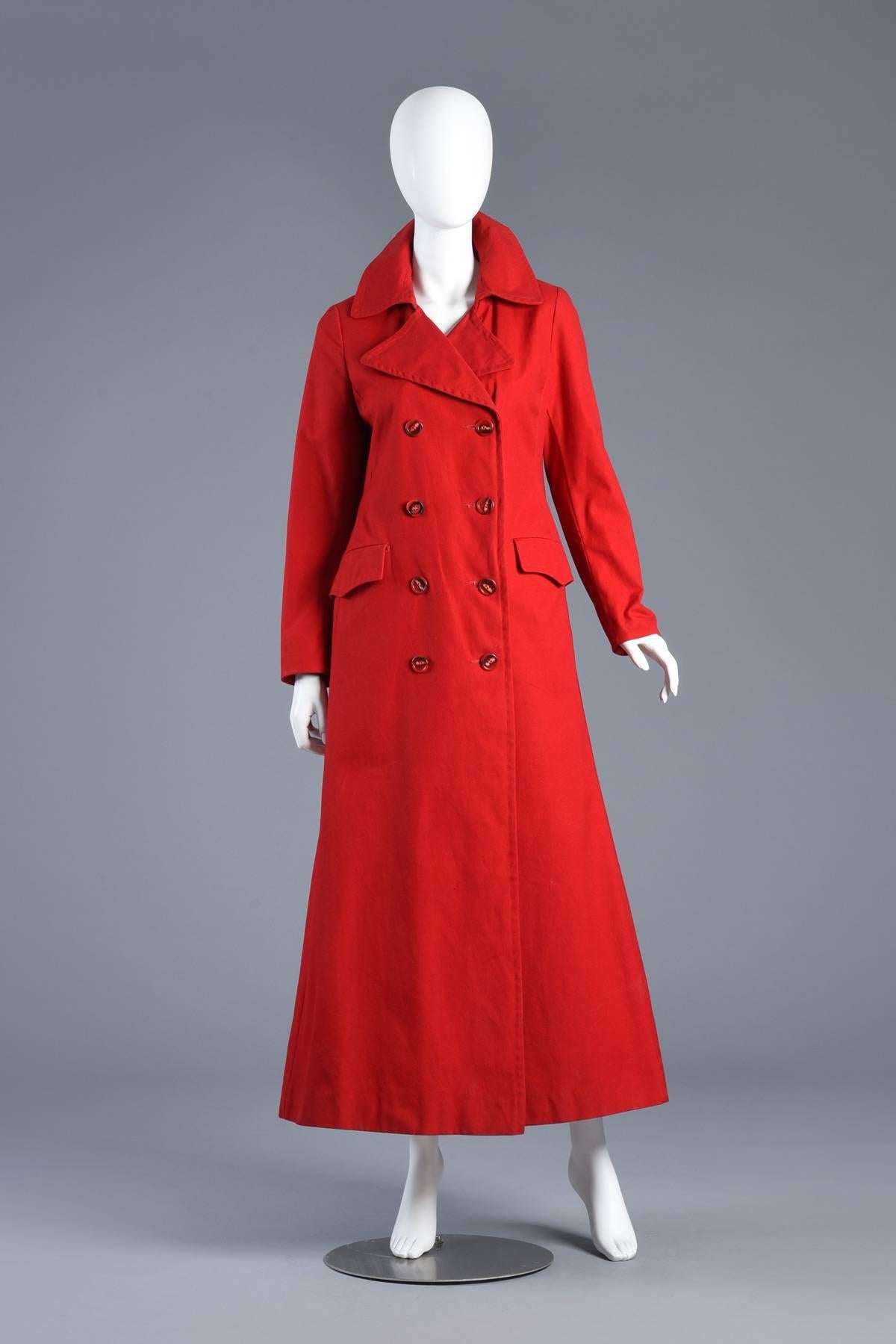 Amazing vintage 1970s floor length cotton trench coat / mac. Rare vibrant red! Double breasted button front. Tabbed pockets. Incredible oversized collar. Slightly nipped waist with super full bottom. Very high quality construction. Excellent vintage