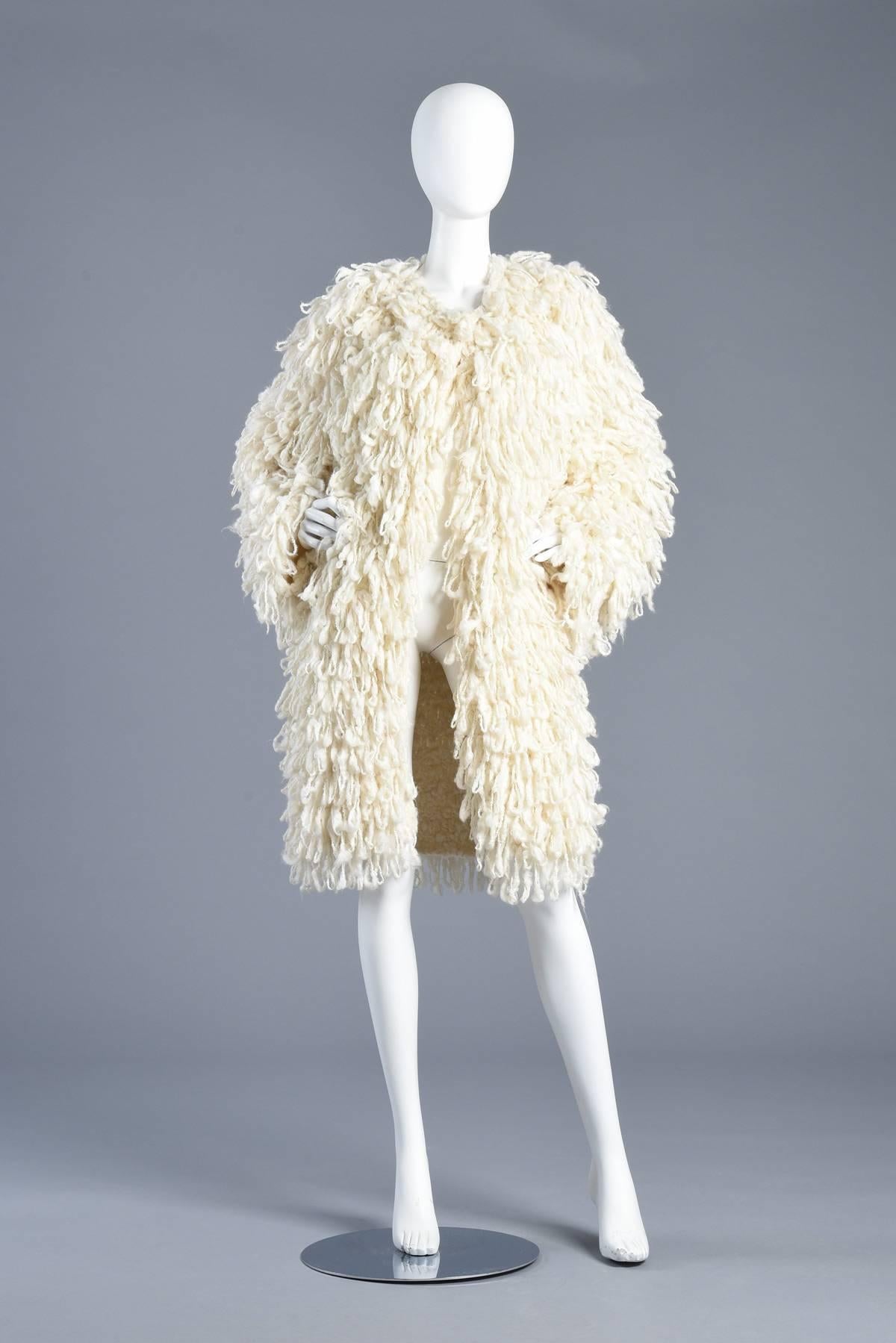 Incredible 1980s ultra shaggy ivory string coat. Such an amazing find. We've had many string coats in the past but never one quite like this. Ultra oversized design with shaggy loop body. Entirely hand knit. Unlined and is intended to fit like a