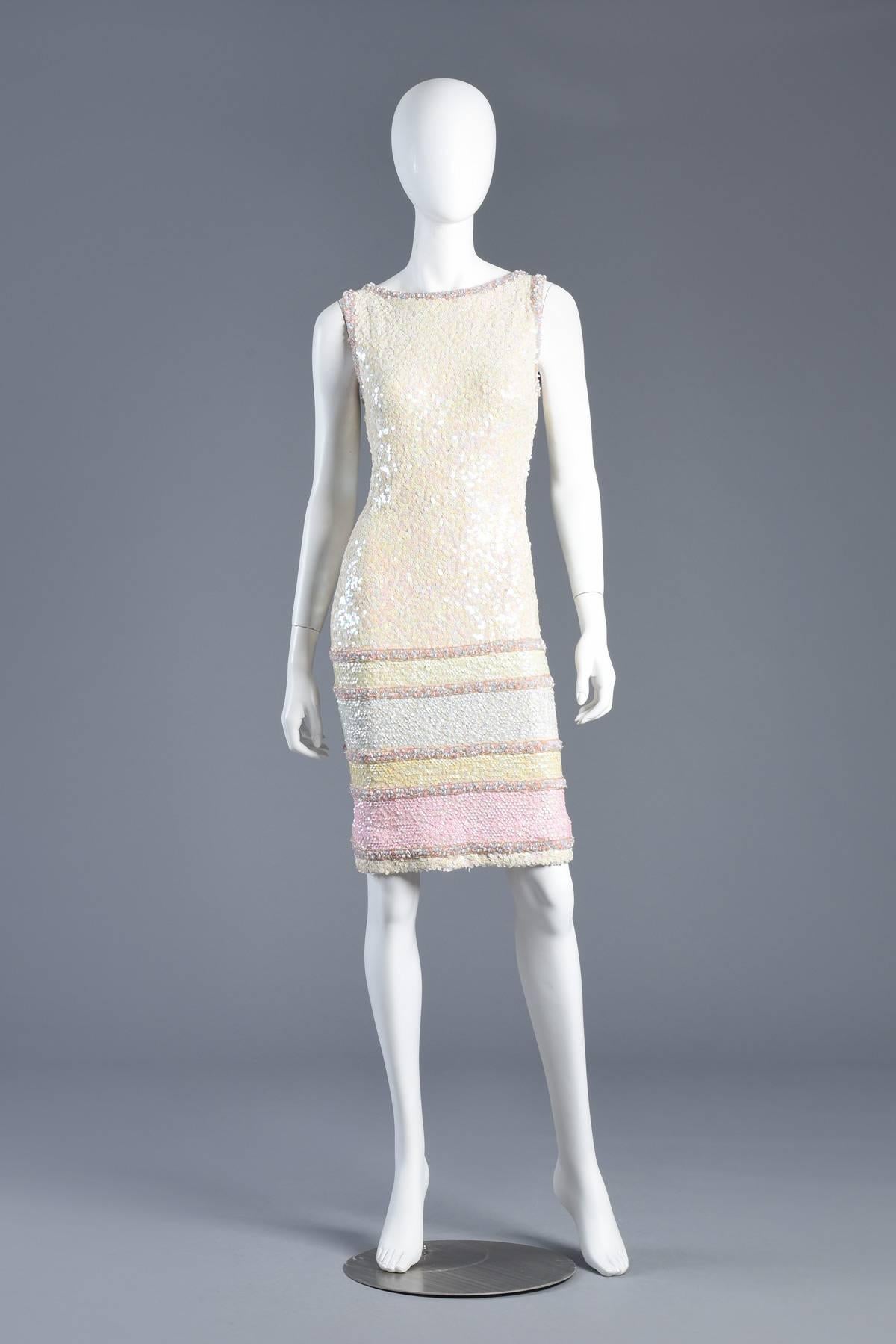 Knockout vintage 1960s sequin encrusted cocktail dress. The perfect Spring dress or Easter get-up. Knit wool ivory dress fully encrusted with pearlescent sequins with pastel colorblock sequin + beaded striping on skirt. Metal zipper in back.