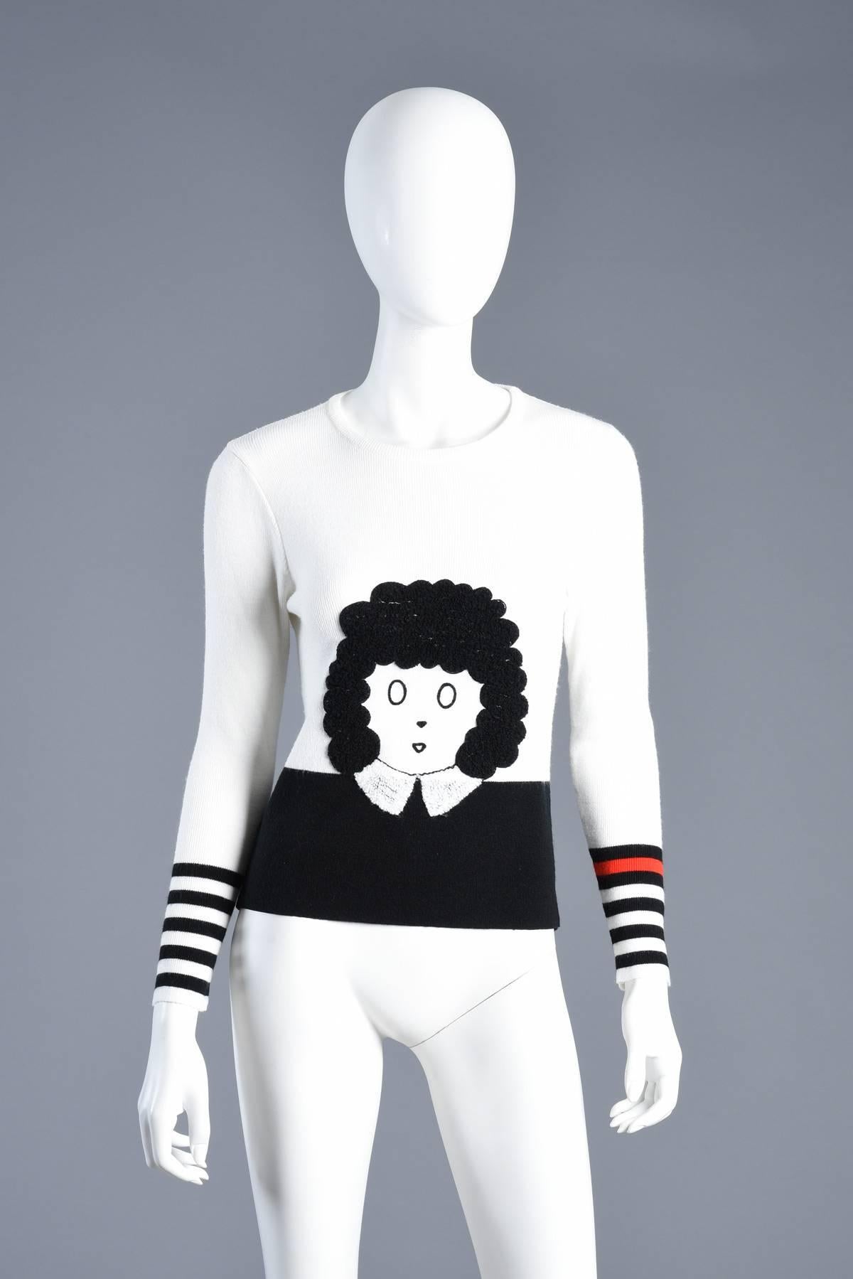 This amazingness doesn’t even really need a description. It speaks for itself. Amazing vintage 1970s Little Orphan Annie novelty sweater. Lightweight ribbed knit top with graphic black bottom + striped sleeves. Appliquéd Little Orphan Annie with 3D