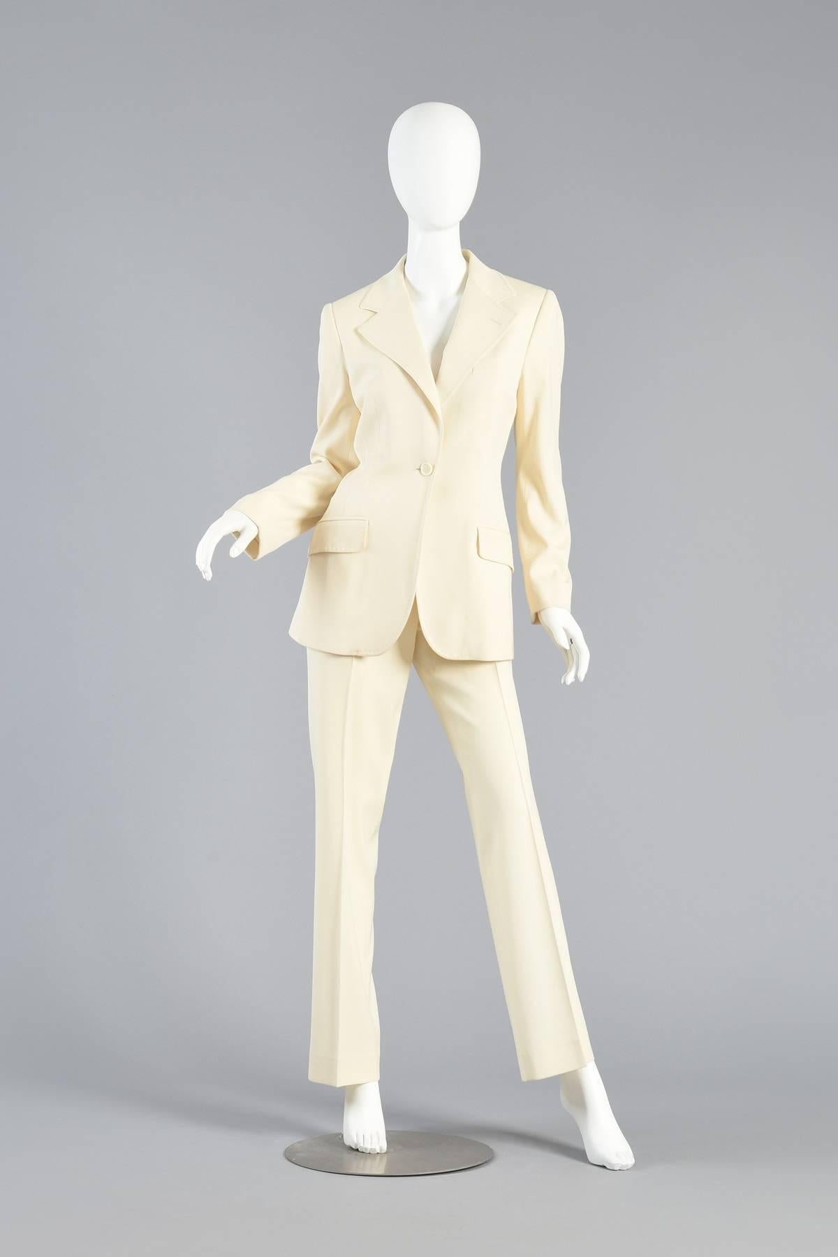 Simple, chic and so utterly classic. Vintage 1990s Dolce & Gabbana ivory suit. Classically tailored trousers and dinner jacket with oversized lapels. Subtle top stitched detailing. Excellent vintage condition. Best fits sizes L but please see