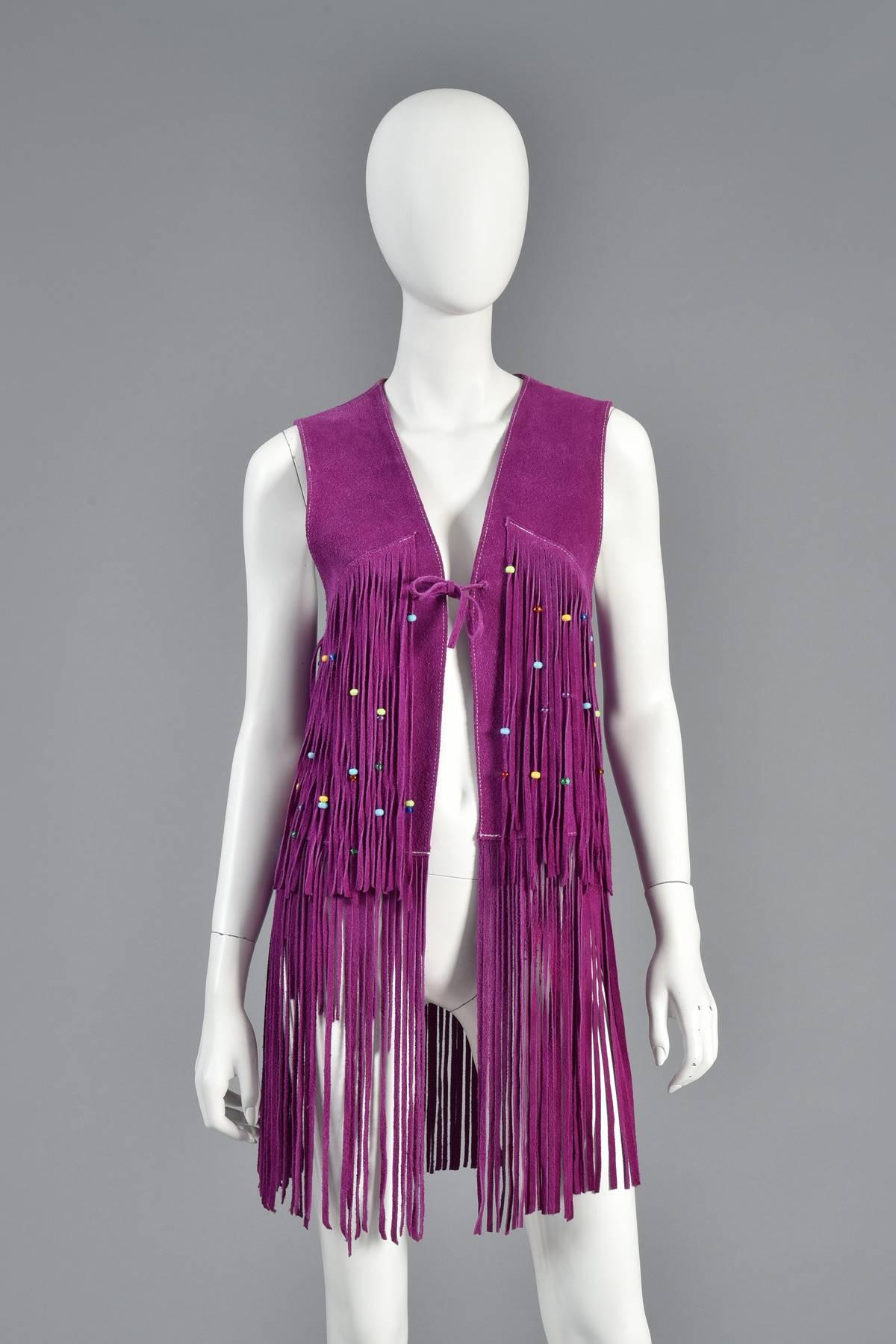Absolutely amazing and extremely hard to find vintage 1960s fringed suede vest. The fringe vests are an absolute must have for any 60s lover but the colored suede are considered the creme de la creme and are the hardest to find. This vest itself is