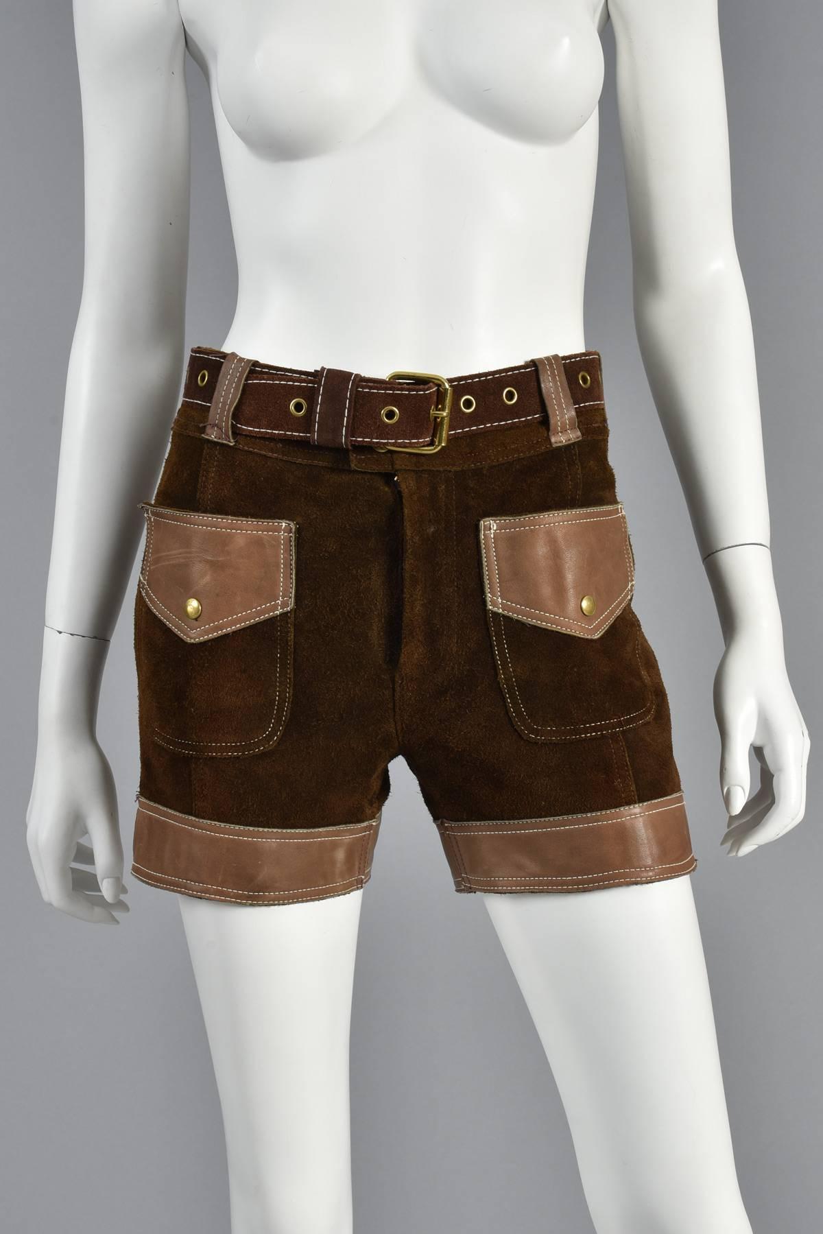 Classic vintage 60s/70s two-tone leather and suede high waisted shorts from Saks 5th Ave. Rich cocoa colored suede with toasted caramel colored leather pockets and trim. Sure to become a staple in any 1960’s loving gal’s wardrobe. Also includes the