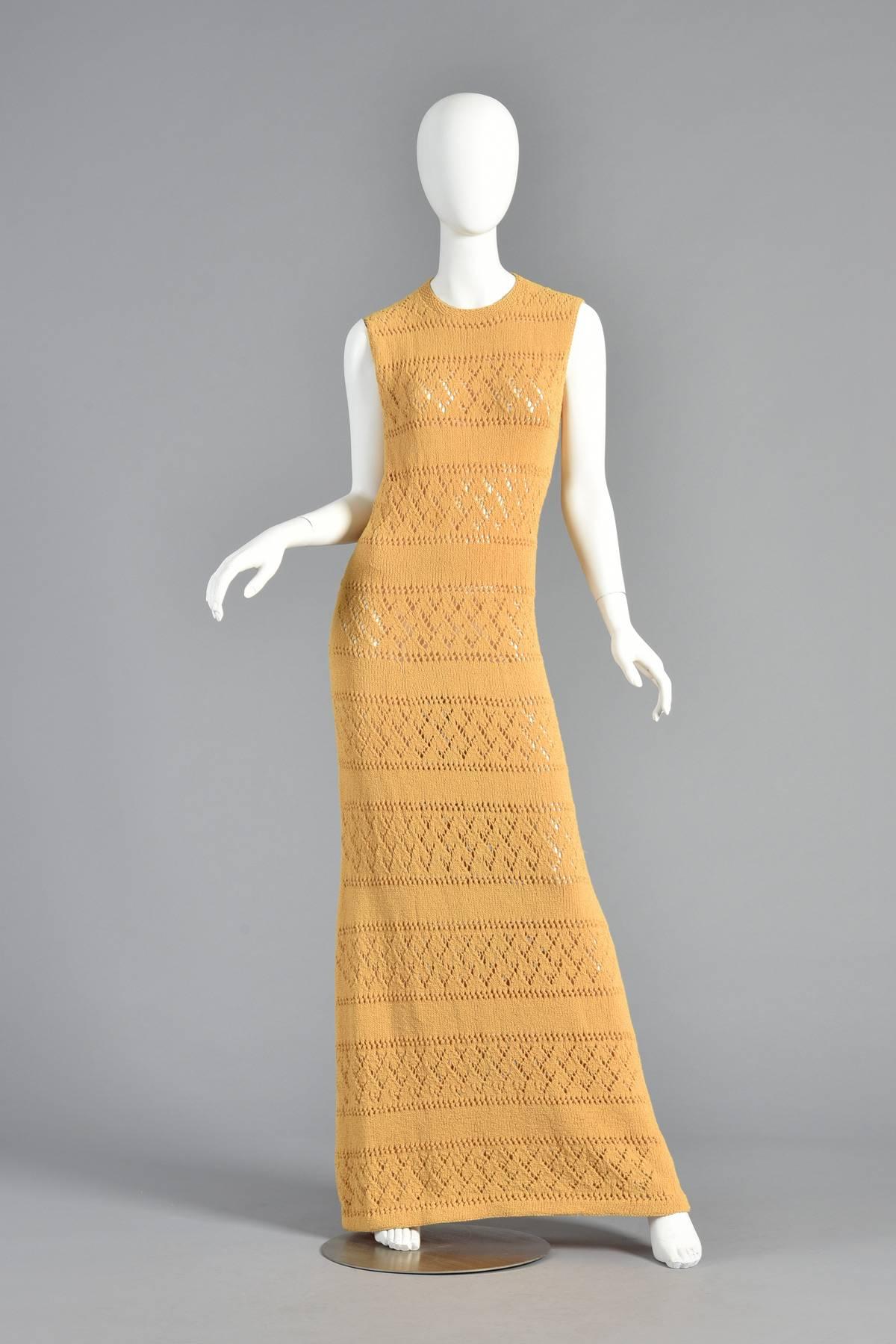 Amazing vintage 1960s floor length knit maxi dress. Beautiful goldenrod color. Sheer, open weave stripes with cascading triangles. Button closure at nape of neck. Excellent vintage condition. 

MEASUREMENTS
Bust: 35-38