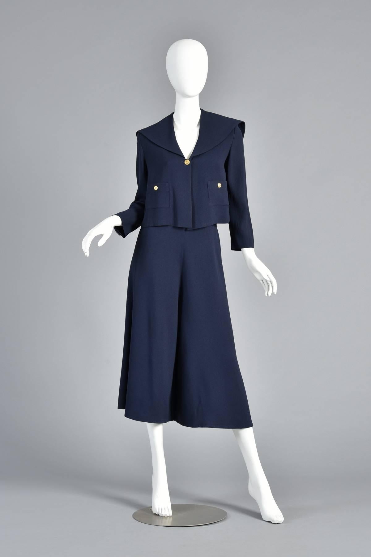 Vintage 1990s sailor style gaucho pant suit by Sonia Rykiel. Jacket features draped sailor shawl style collar with caped back. Boxy, swing cut with dual pockets. Gold tone faux-button buttons. Matching super wide legged gaucho pants! Excellent