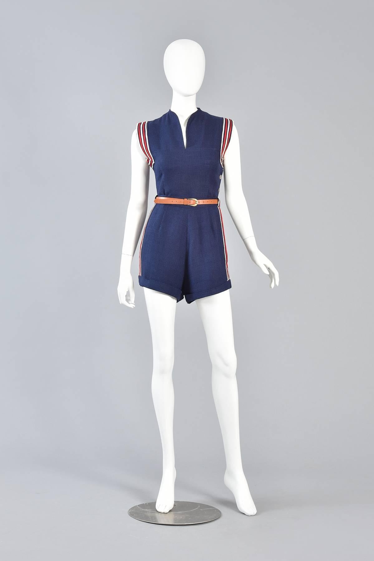1940s Red White & Blue Button Up Playsuit

Bustown Modern is so happy to offer this super adorable 1940s navy blue 2 piece playsuit. Set consists of small fitted top and classic high waisted cuffed shorts. 

Fitted woven top with notched