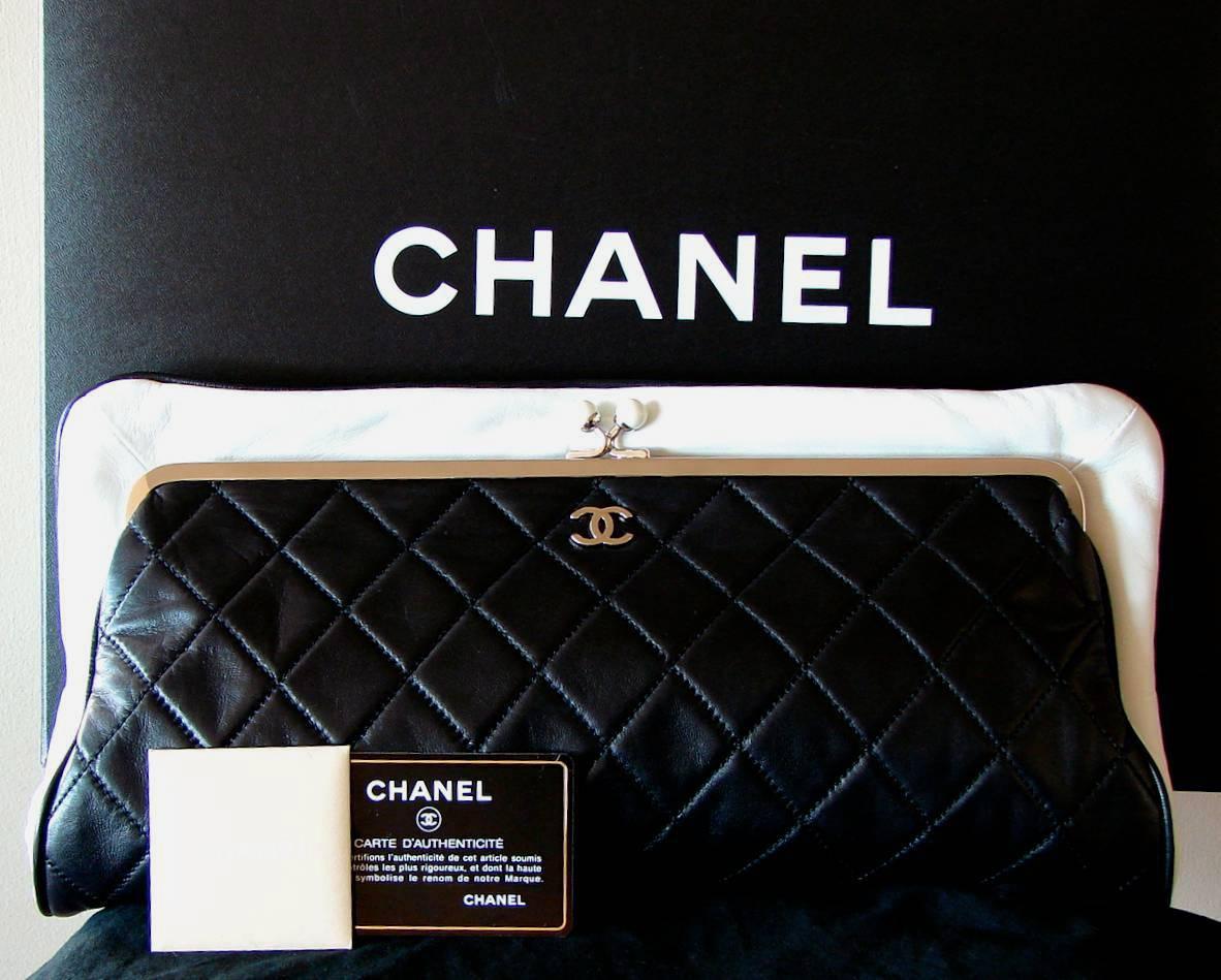 This incredible matelassé envelope clutch bag was designed by Karl Lagerfeld for Chanel Paris as part of the 2009 collection.  Made from black lambskin, this fabulous bag is trimmed in snow white leather with silver hardware.  The kiss lock