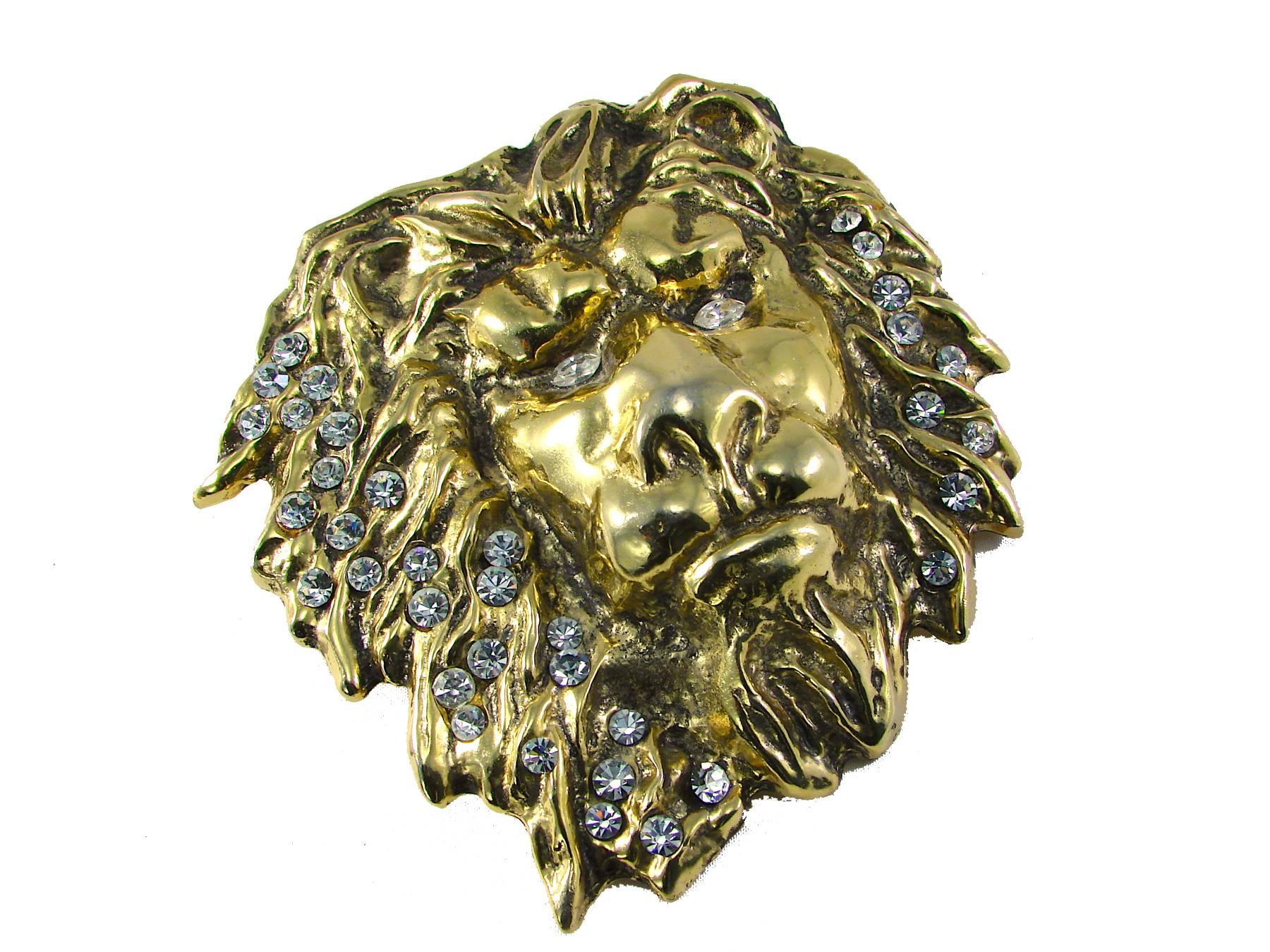 This unusual belt buckle was made by Laloon in the early 1980s.  Made from gold metal, it features rhinestone accents throughout the mane and in the eyes.
Substantial in size, it measures 4.5