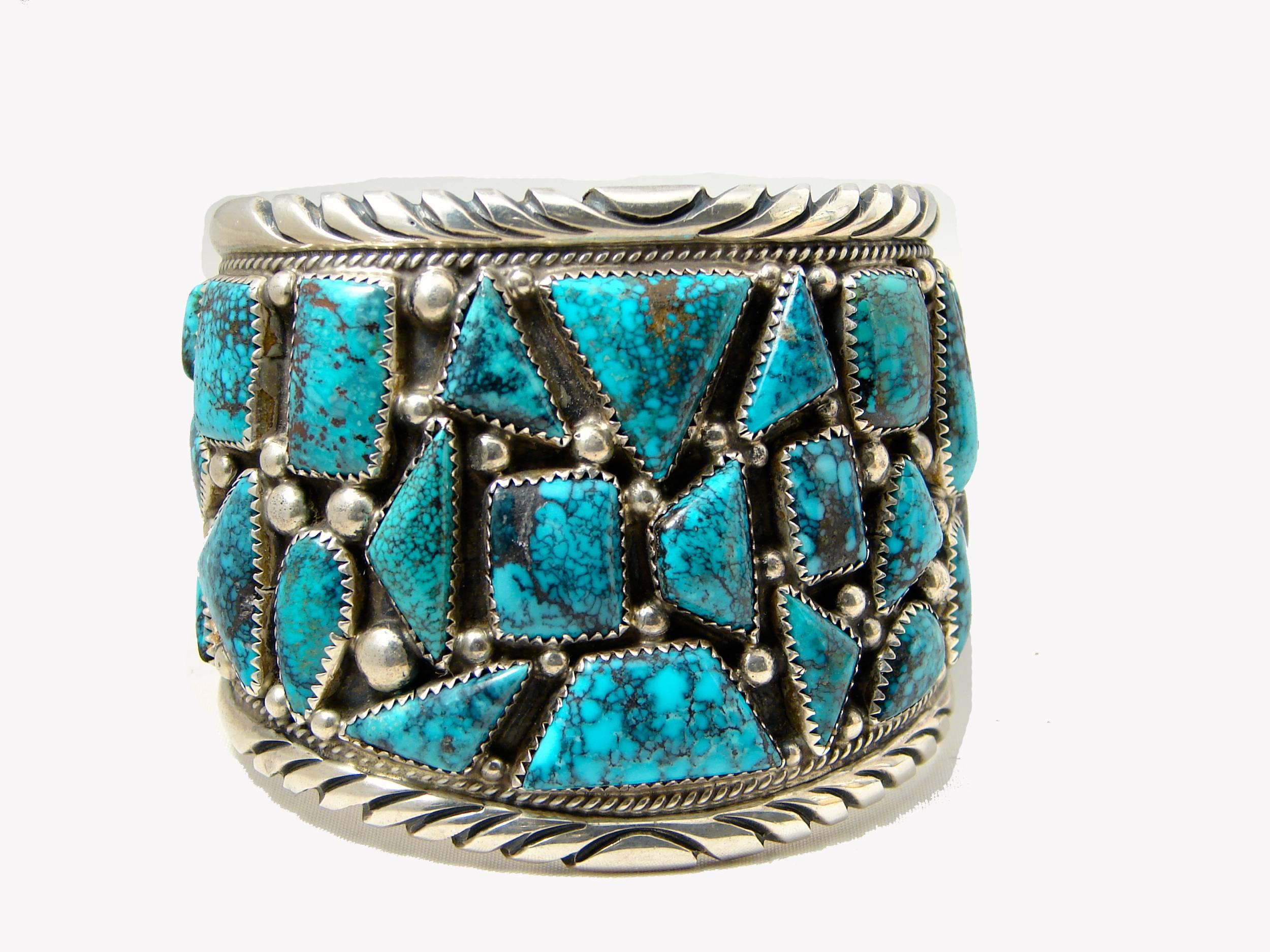 Here's a stunning large Turquoise and Sterling Silver Cuff Bracelet from Navajo artisan Tommy Moore.  This is one of his earlier designs and it features chunky turquoise throughout. It measures 2.25