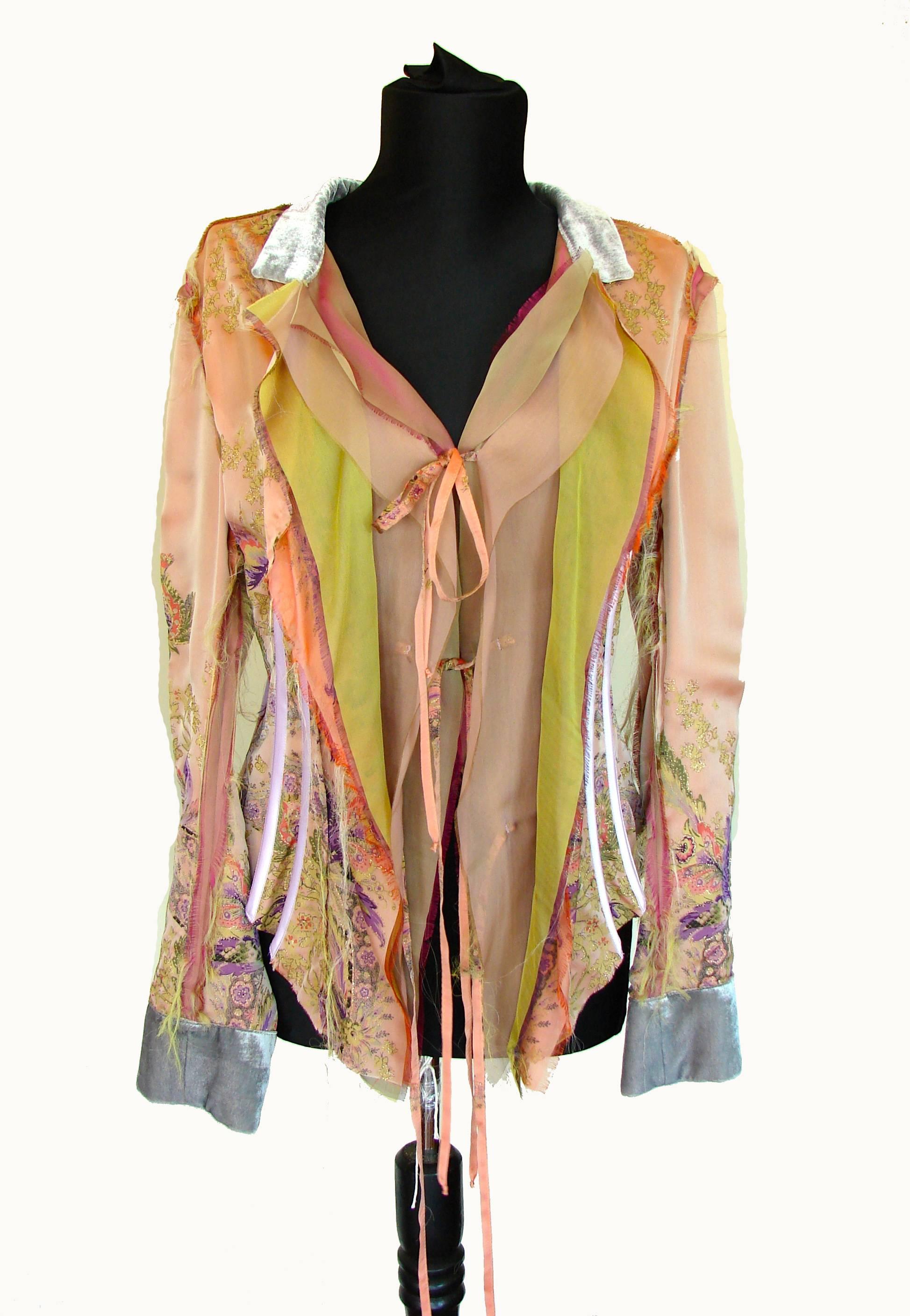 Here's a cool jacket from Roberto Cavalli made from unfinished layers of silk in shades of peach, lime & lilac, and gray shimmering velvet trim at the cuffs and collar.  This piece also features boning at the sides and back - all covered in lavender
