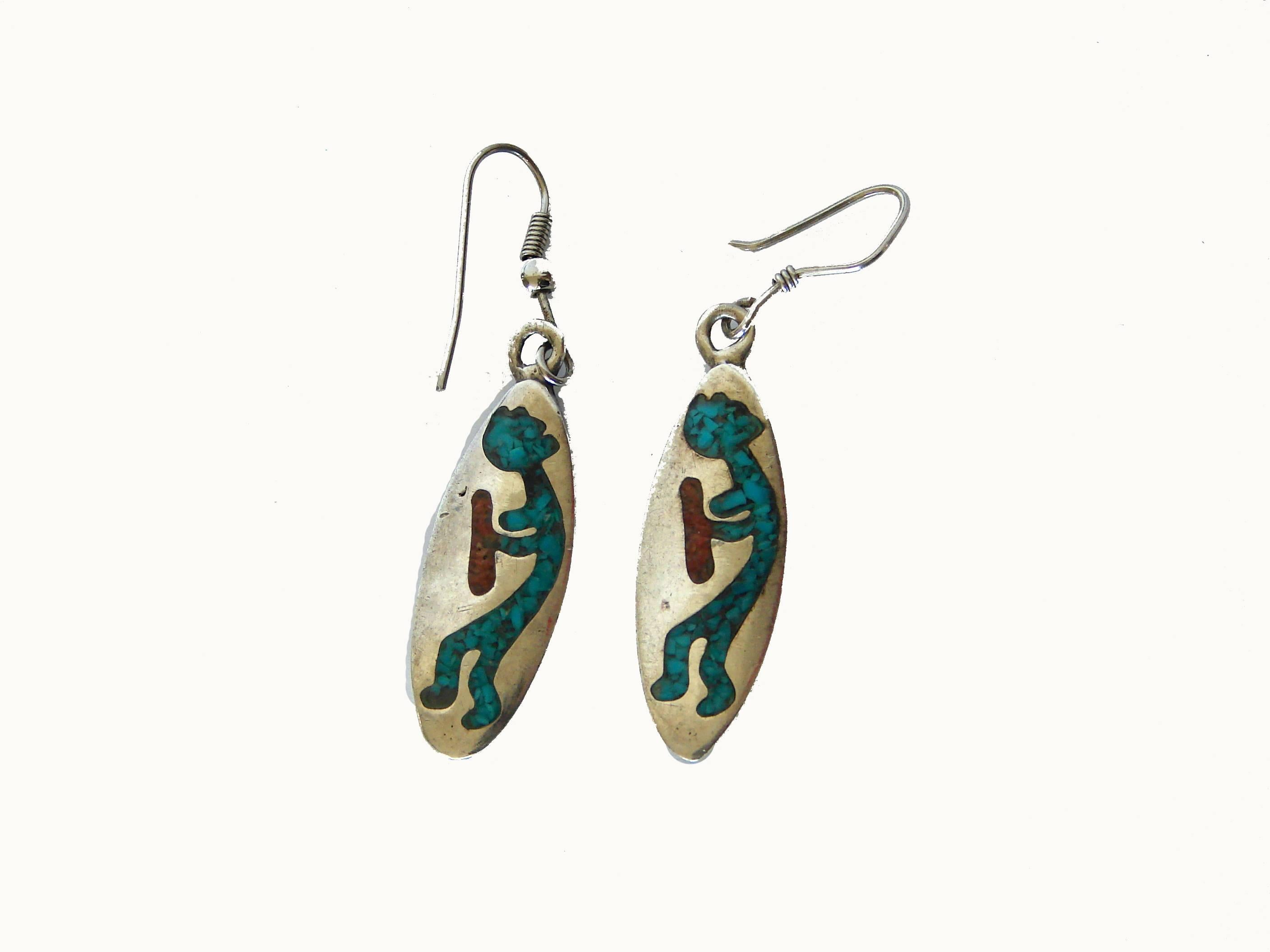 Here's a great pair of turquoise and coral inlay earrings from the early 1970s.  They feature Kokopelli or the Hopi Flute Player on a sterling
silver long oval disk. Unsigned and without a hallmark, these are in excellent condition for their age,